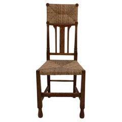 Goodyers im Regent St. George Walton-Stil. Ein mit Intarsien versehener Binsenstuhl im Arts & Craft-Stil