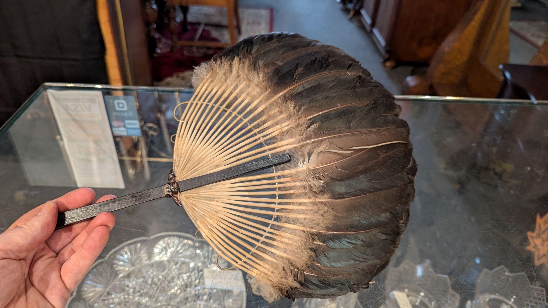 Beautiful Victorian goose plume hand fan in perfect condition.  This fan is perfect for use, or in costume, or display piece, put into a shadowbox frame. Wood handle with metal strung through the feathers for support.