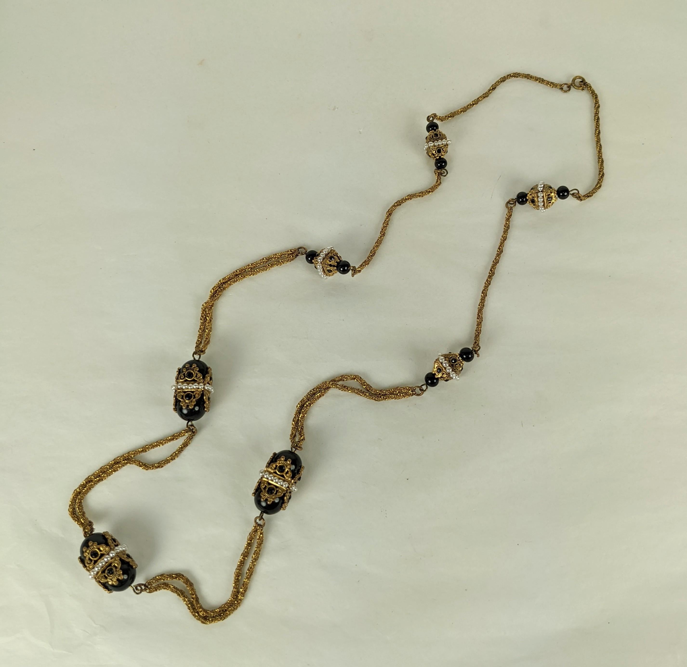 Goossens for Chanel Byzantine sautoir necklace of eight stations of  textured  and twisted woven snake chain, small and large round jet pate de verre beads, and jet decorated square byzantine style caps. Further enhanced with fine faux seed pearls 