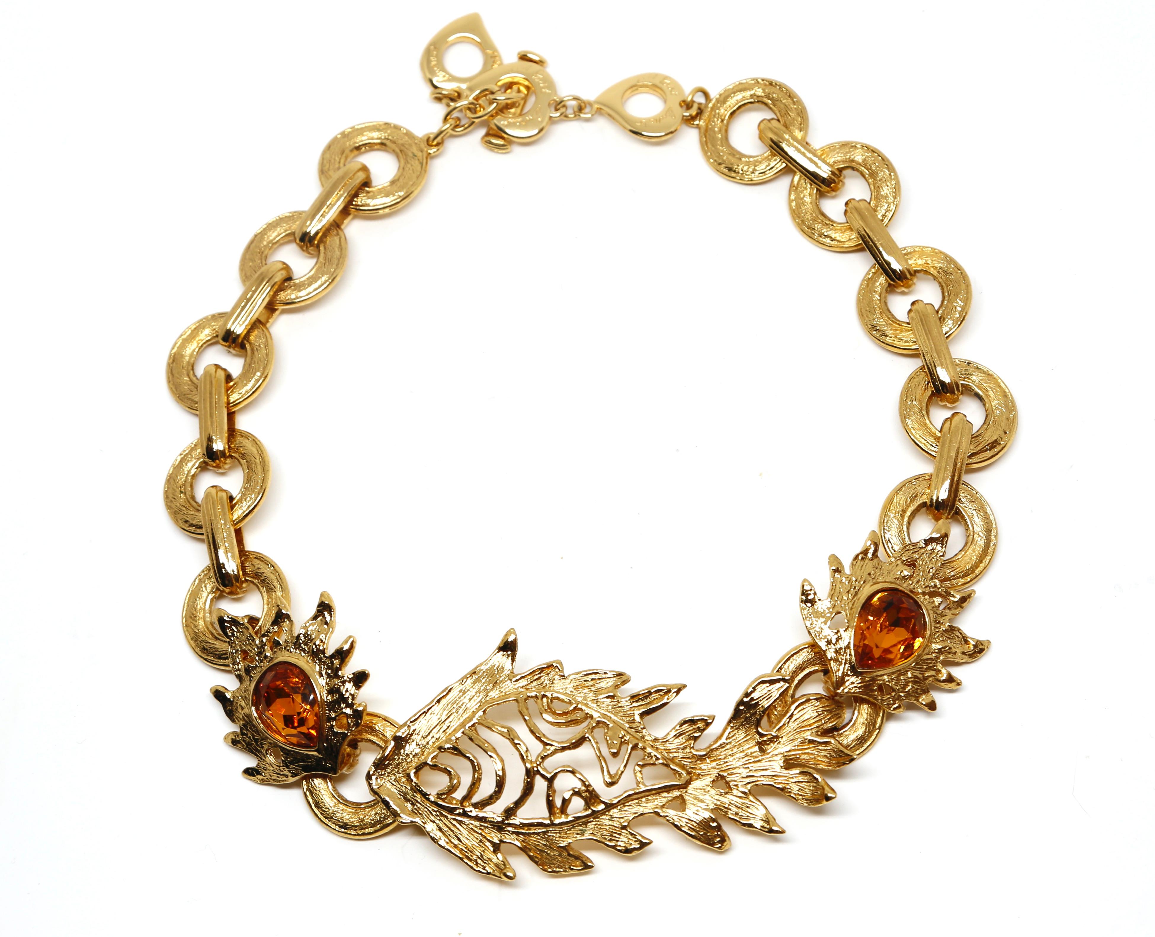 Gilt metal necklace in an unusual fish motif with faceted topaz crystals made by Robert Goossens for Yves Saint Laurent dating to the late 1980's, early 1990's. Necklace measures approximately: 18.25