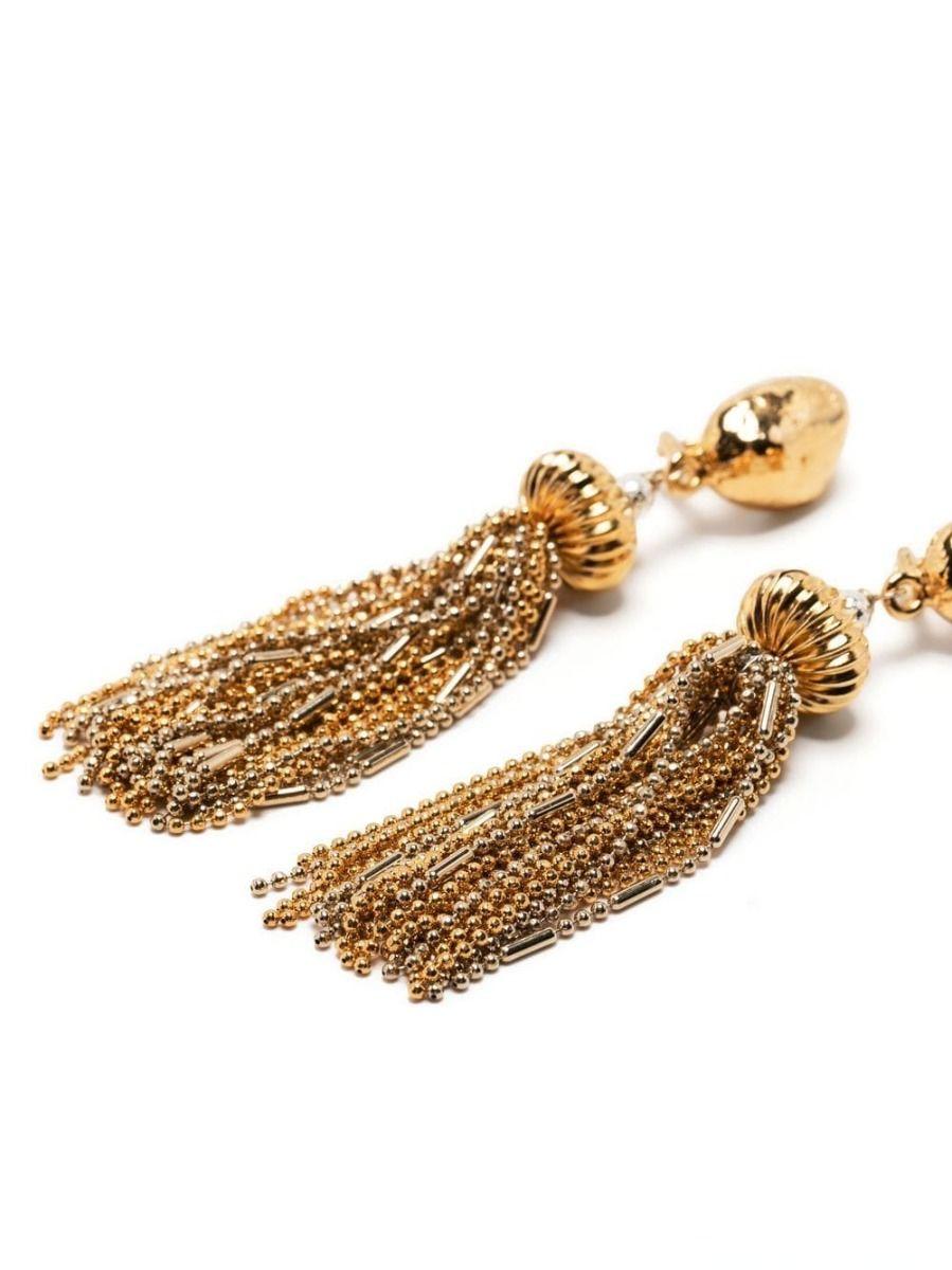 Designed by Robert Goossens, these vintage earrings display gold and silver beaded tassles hanging from a gadrooned ball. Finished with a small pearl, these earrings can be secured using a clip-on fastening. Sweep your hair back and let these unique
