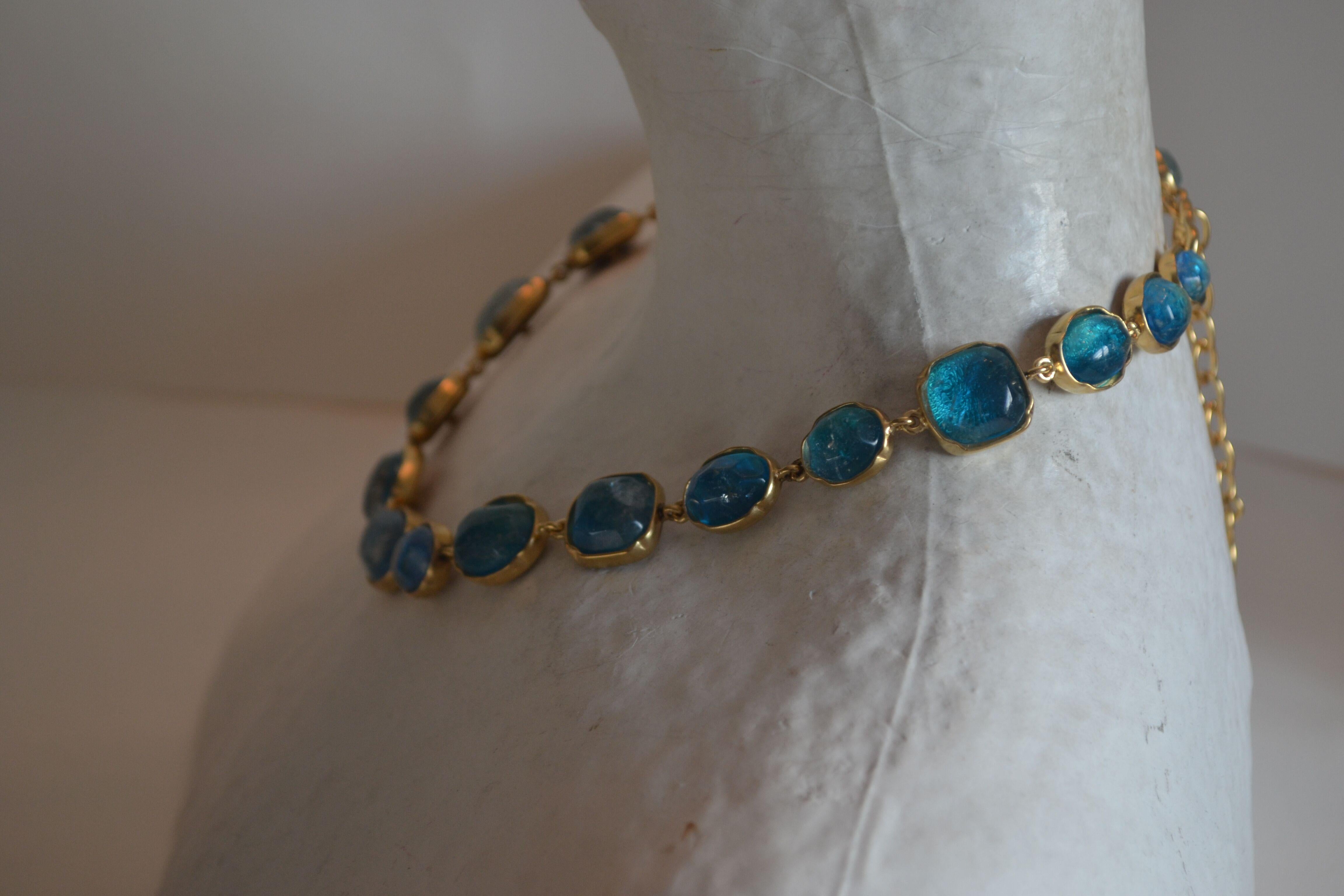 Blue tone rock crystal necklace (hand painted) set in 24k plated brass from Goossens Paris.
