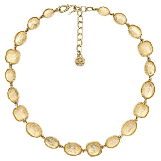 Clear rock crystal necklace set in 24k plated brass from Goossens Paris. 
A timeless theme that sees its colors change with the seasons. Each rock crystal stone is hand-dyed with beautiful shades. As each stone is unique, the intensity and depth of