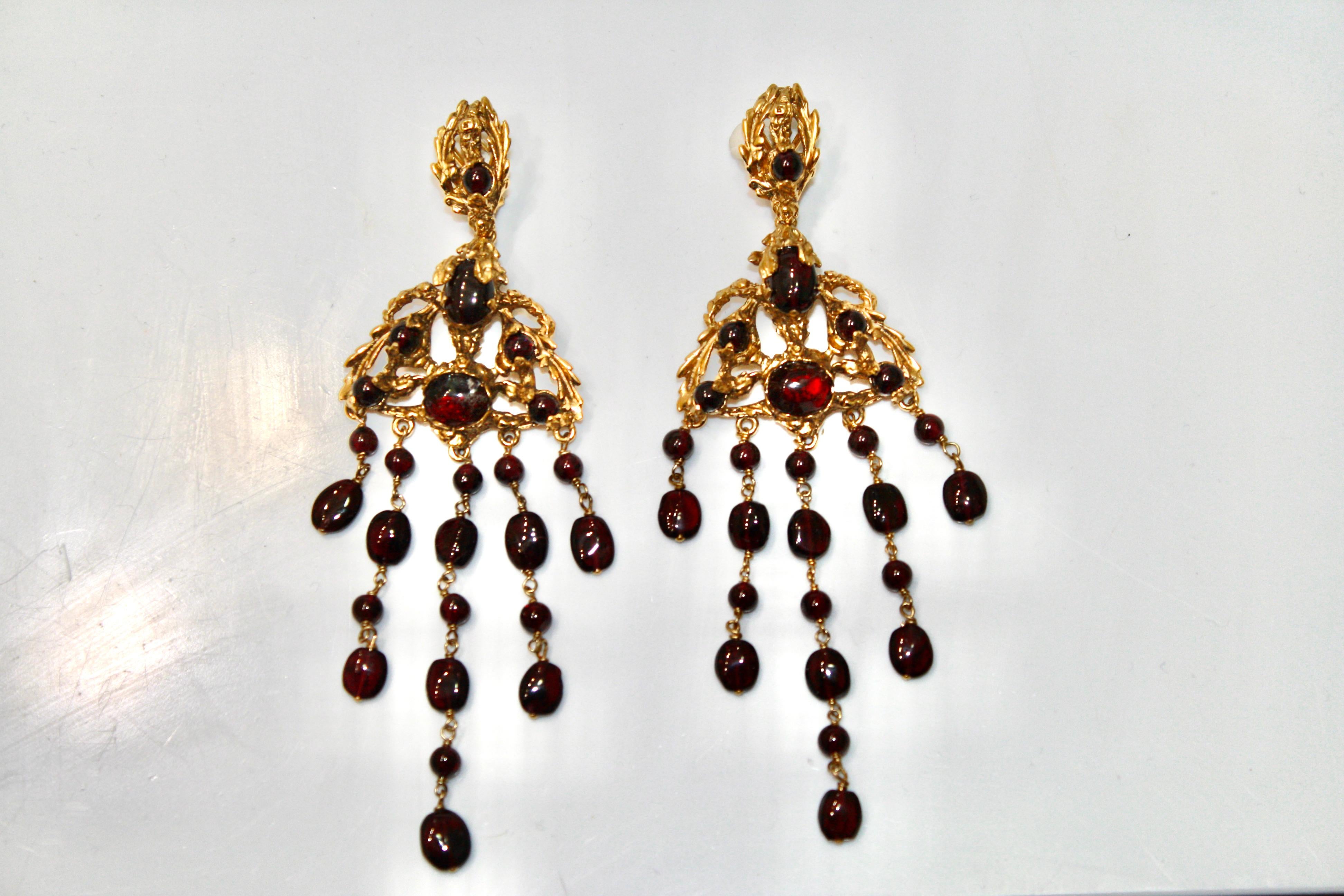 From the Empire Goossens Paris collection,  24 carat gilded bronze and garnet french back pierced earrings.