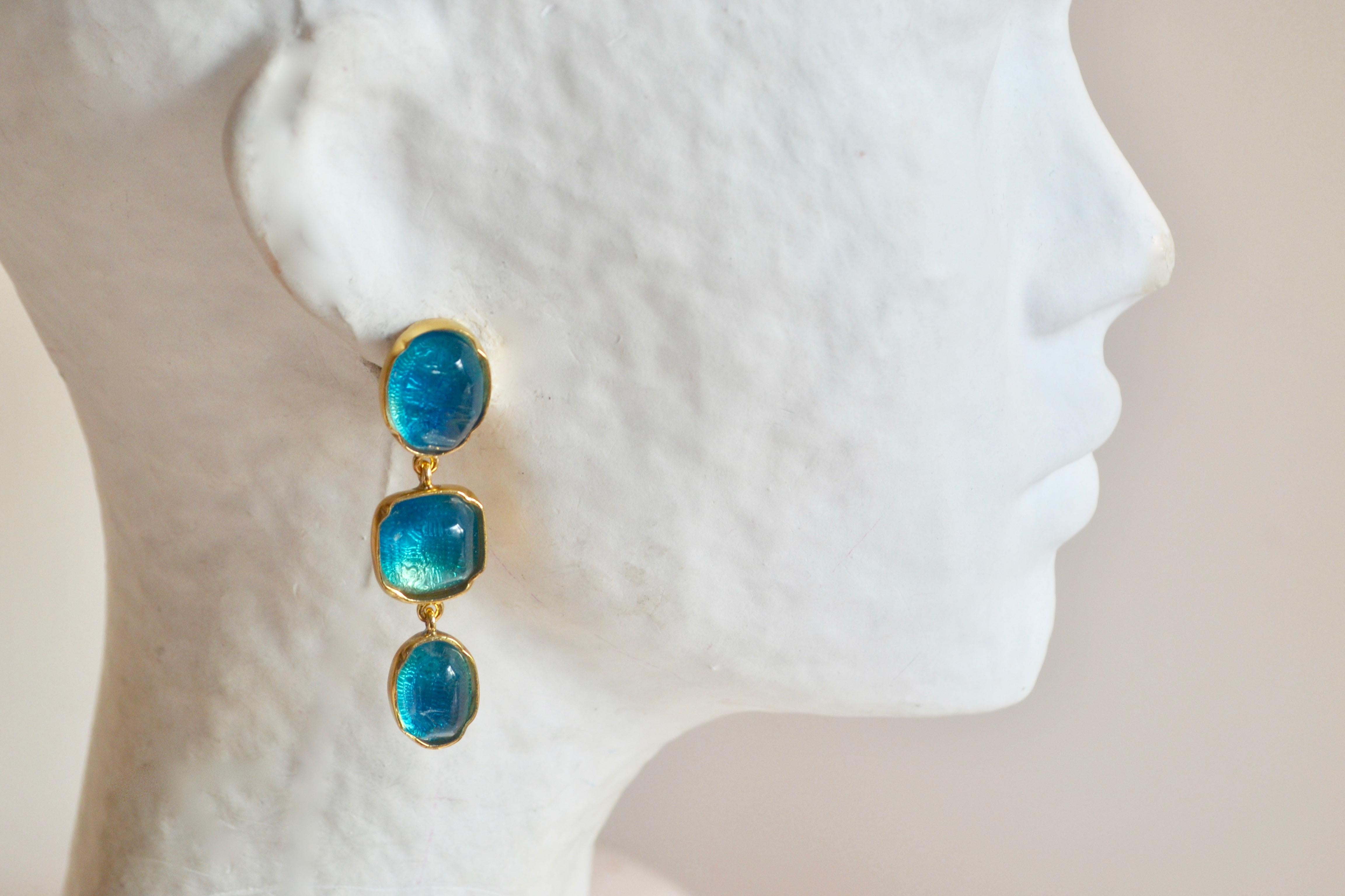 Hand tinted blue rock crystal triple drop clip earrings from Goossens Paris. Set in 24 karat gold plate. 