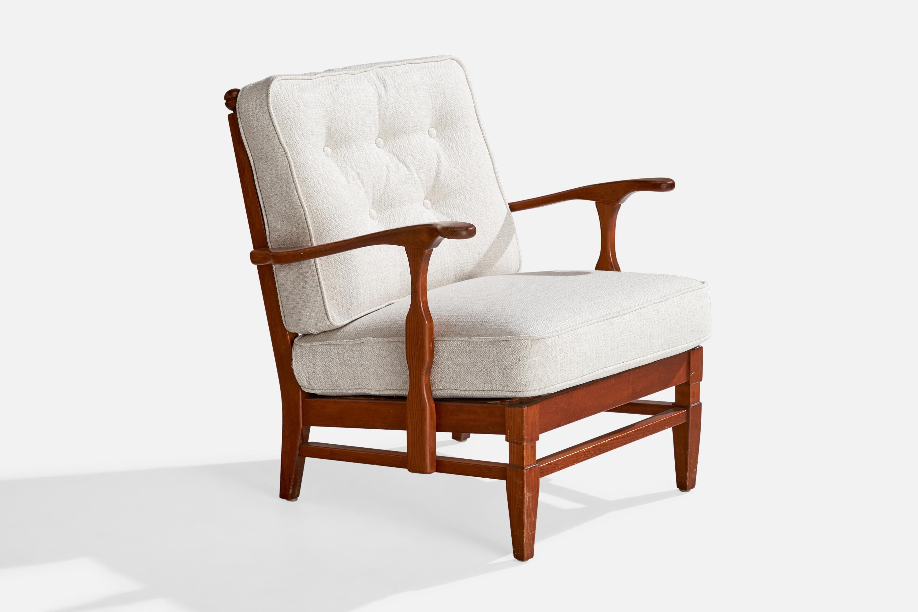 A dark-stained pine and white fabric 