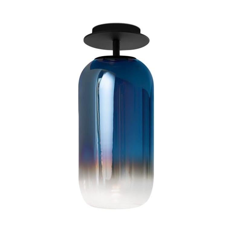 Gople classic ceiling light in black/blue for Artemide. 

The Gople Lamp is the latest product in the ongoing collaboration between Artemide and Bjarke Ingels Group. The basic form of the Gople Lamp enhances the beauty of the glass, which is