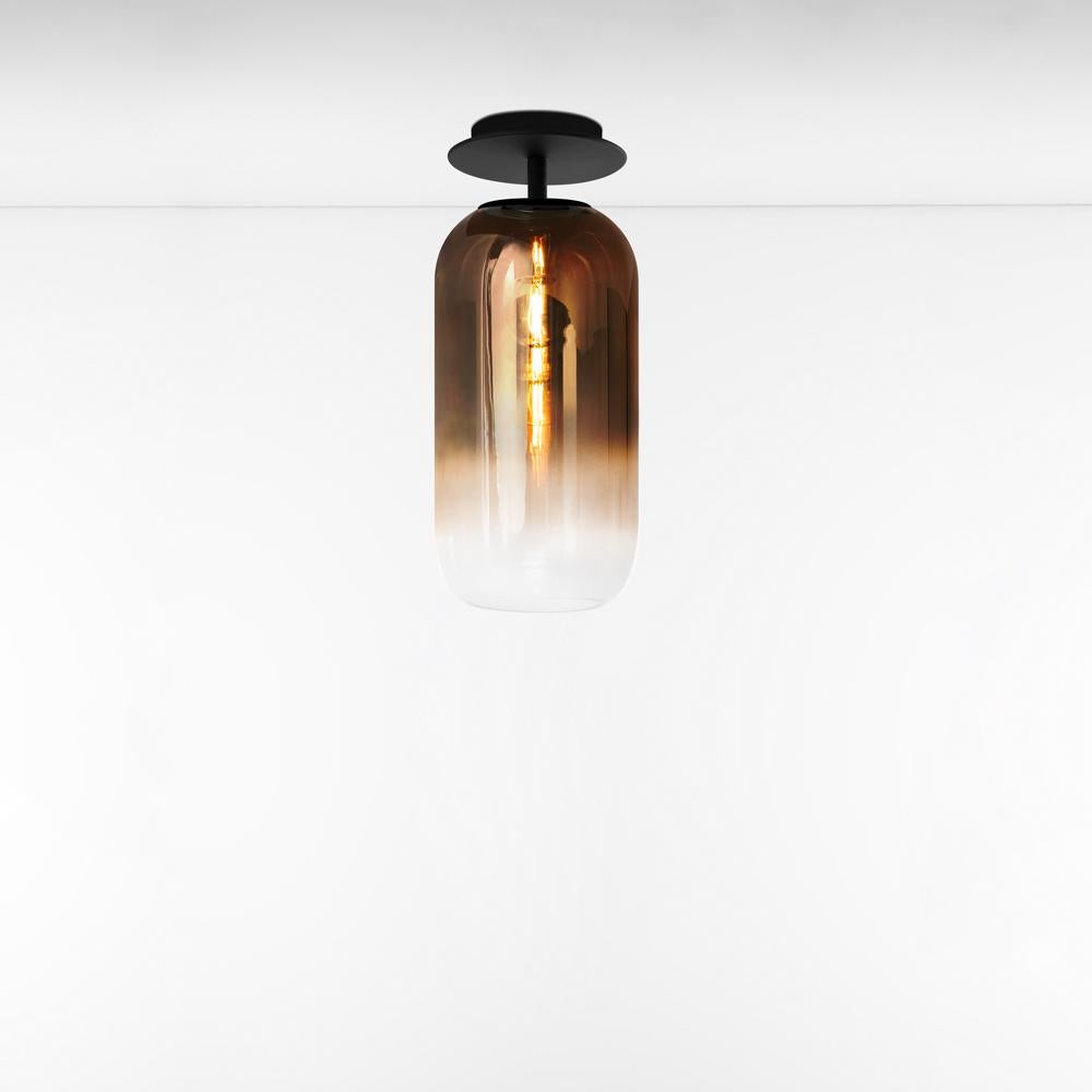 Gople classic ceiling light in black / bronze for Artemide. 

The Gople lamp is the latest product in the ongoing collaboration between Artemide and Bjarke Ingels Group. The basic form of the Gople Lamp enhances the beauty of the glass, which is