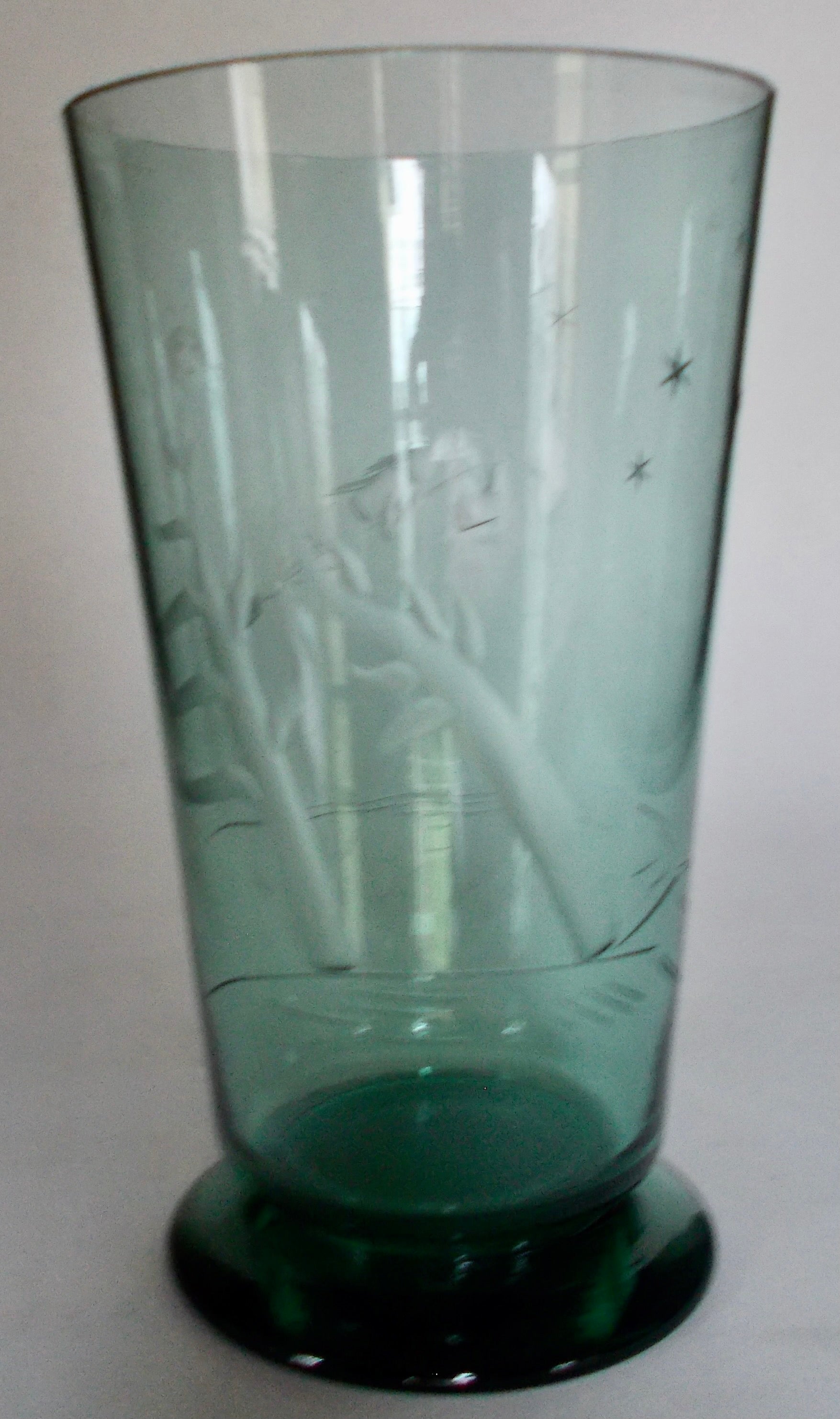 Beautiful early 1930's vase by Goran Hongell (1902-1973) for Karhula Finland. Has wonderful engraved images of stars, trees and a woman flying on a broom! Signed and in excellent condition.