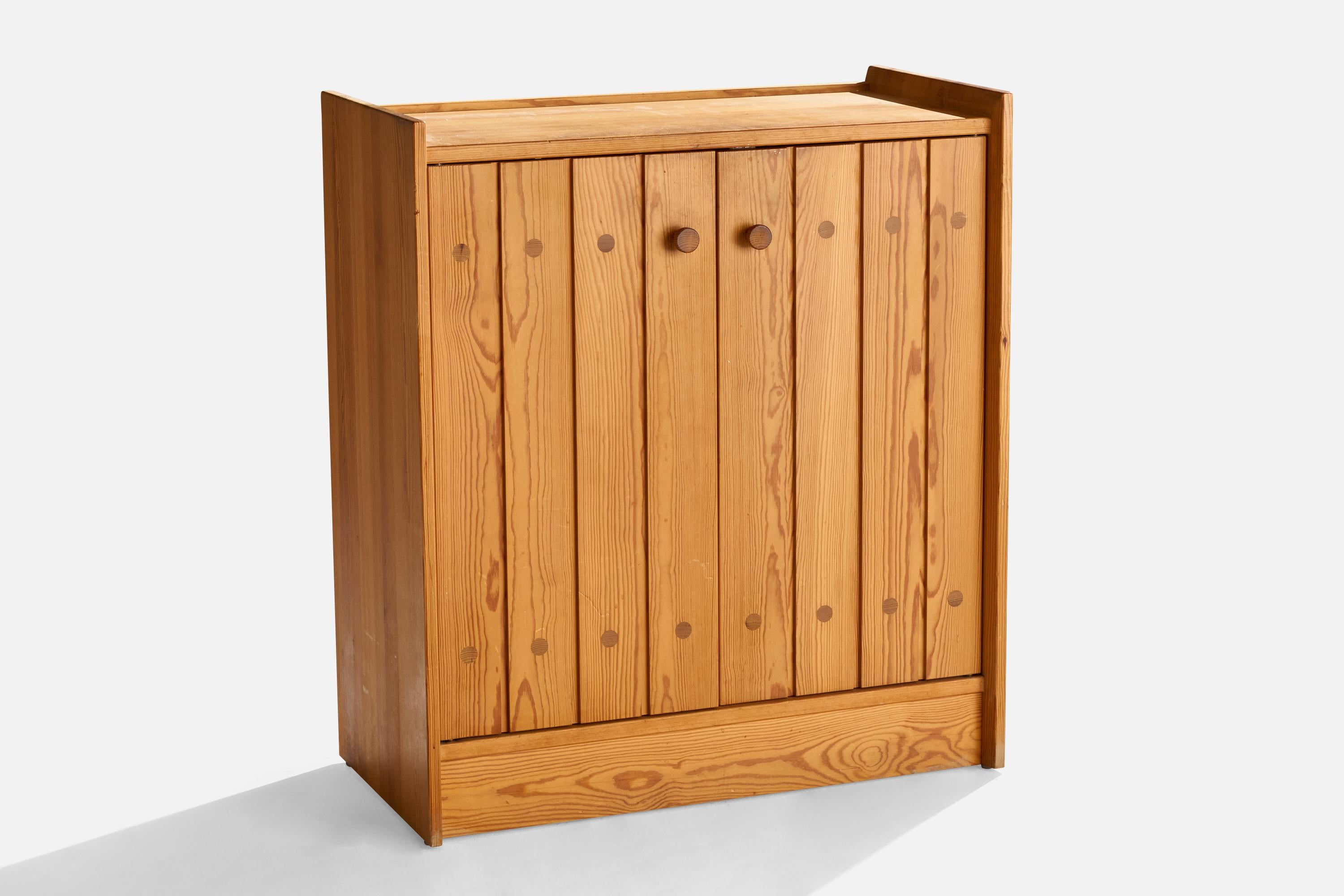 A pine cabinet designed by Göran Malmvall and produced by Karl Andersson & Söner, Sweden, 1970s.
