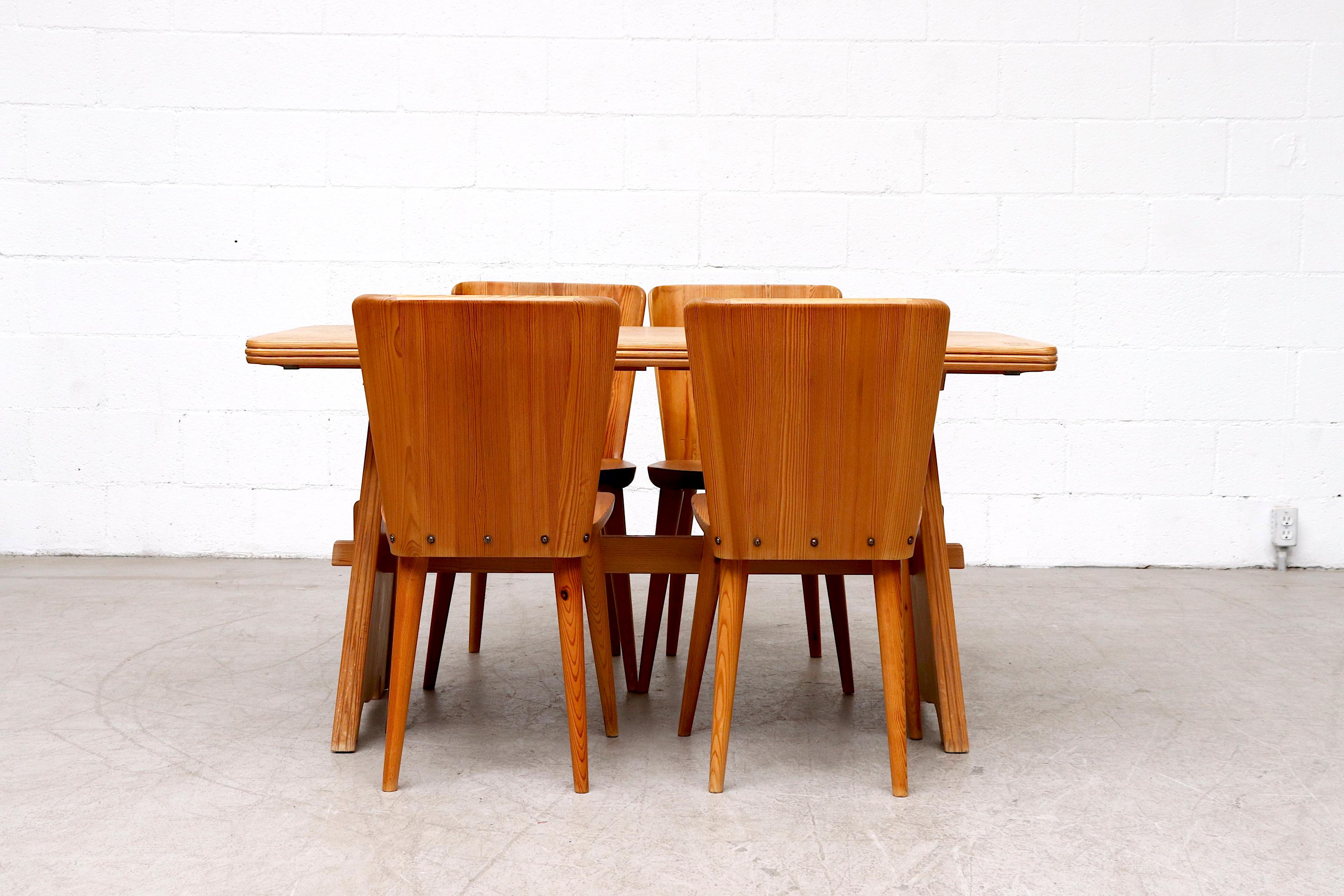 Beautiful Göran Malmvall midcentury pine trestle dining table with double leaf extensions. In original condition with wear consistent with its age and use. 