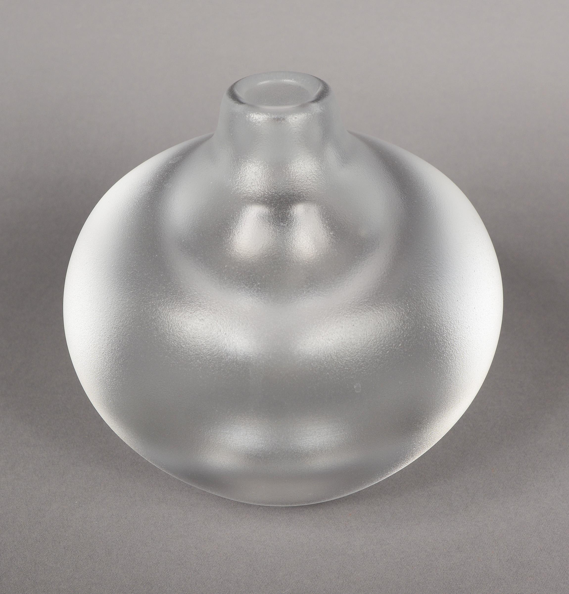 Vase from the Kosta Royal Art Collection designed by Goran Warff. This vase has very thick walls, a large internal bubble in the bottom and an acid treated exterior. All this creates an interesting optical effect. There is a tiny ding on the side of