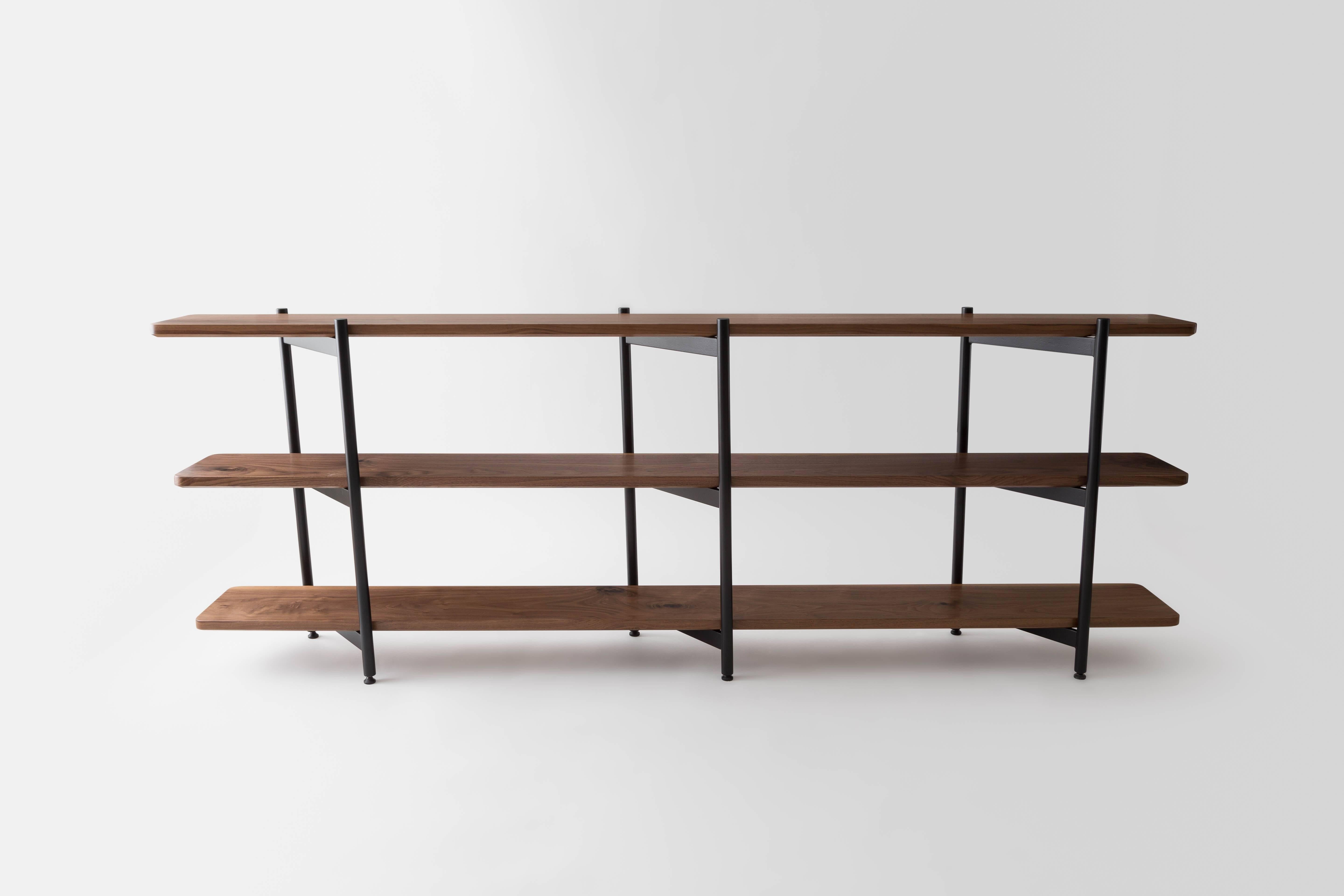 The Gordo bookcase is constructed in our Brooklyn studio and local partners using premium domestic hardwoods and powder coated steel. The angled legs allow the shelving unit to be freestanding without the need of a back support so it can be accessed