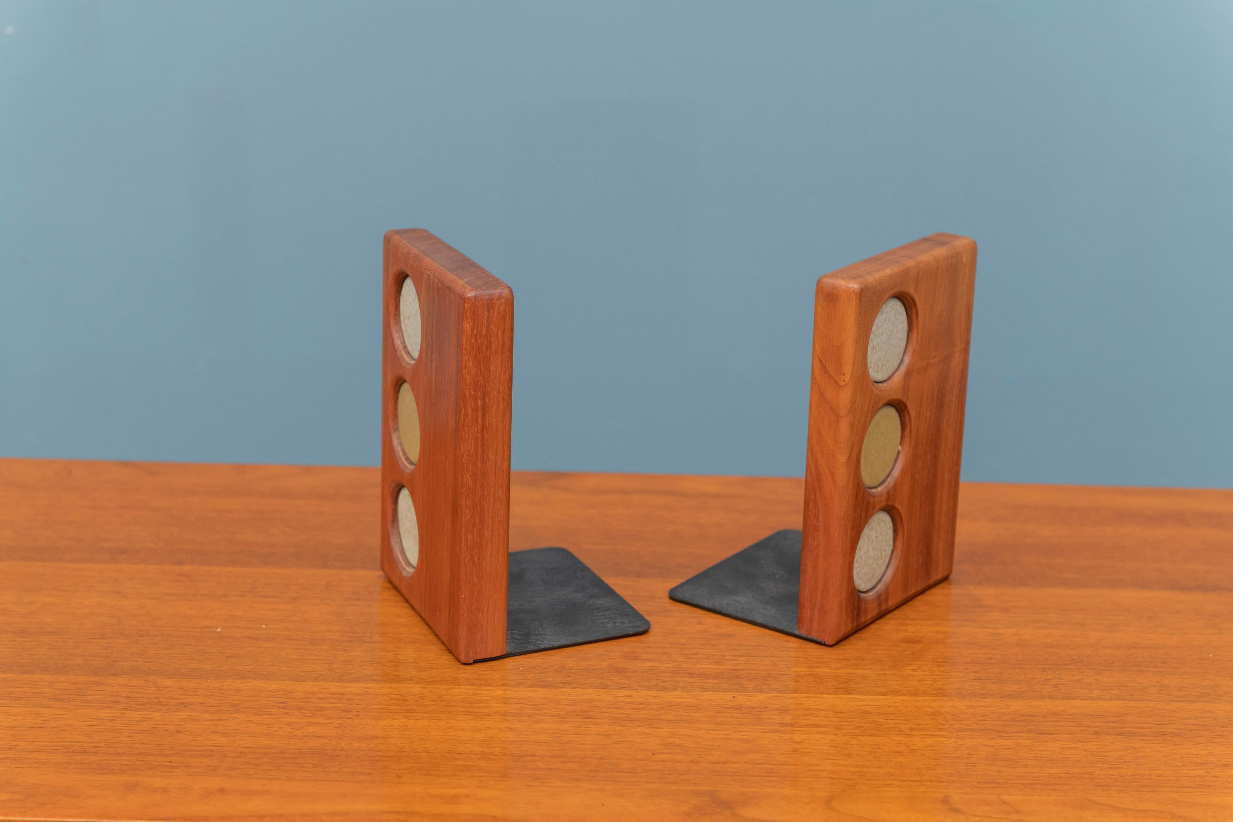 Gordon and Jane Martz bookends for Marshall Studios. Signed with manufacturer's label, made from black walnut and inlayed multicolored ceramic circles.