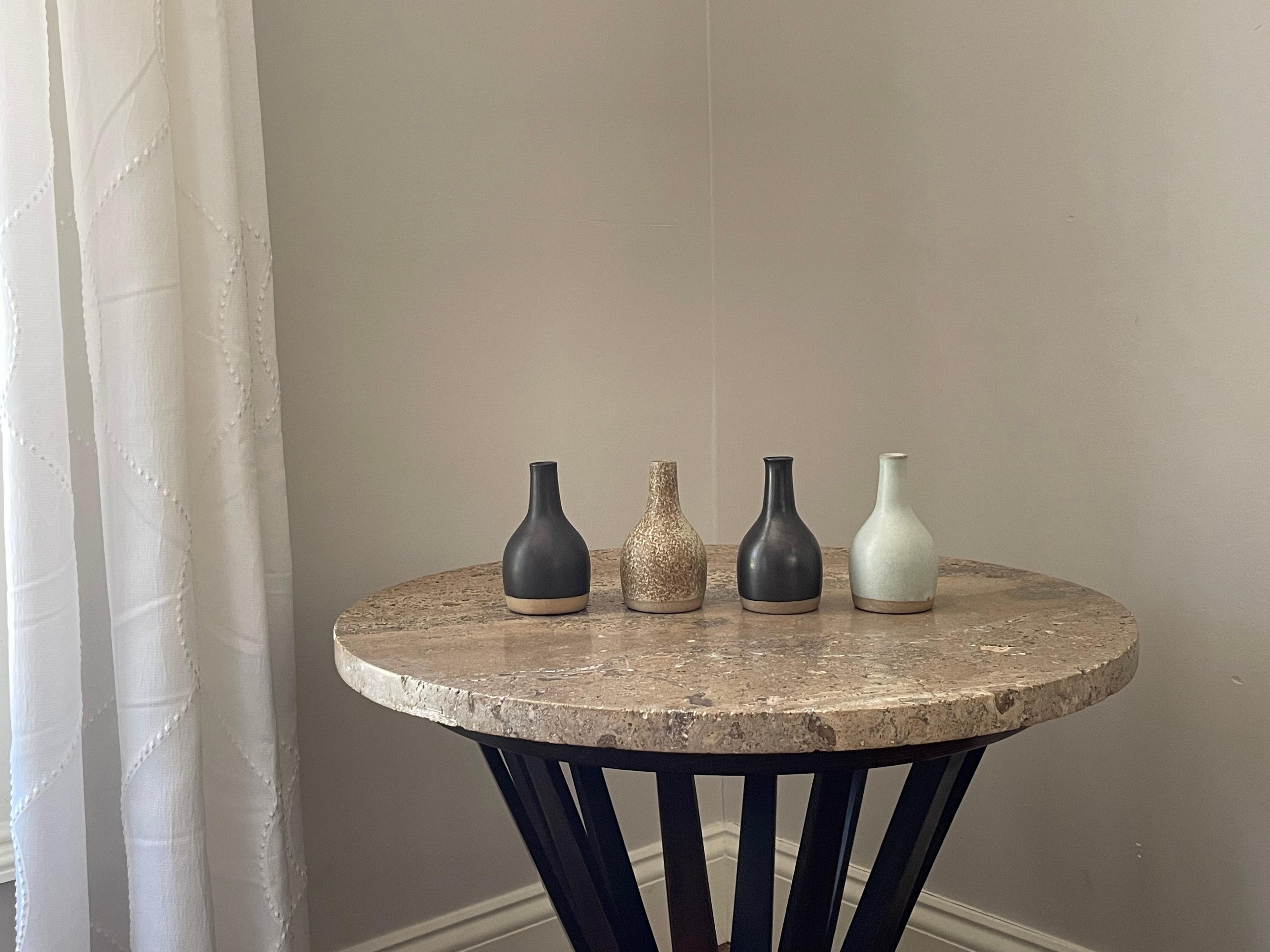 A collection of four small vases designed by Jane and Gordon Martz for Marshall Studios. Famous for their lamps, Jane and Gordon designed many different household ceramic items.