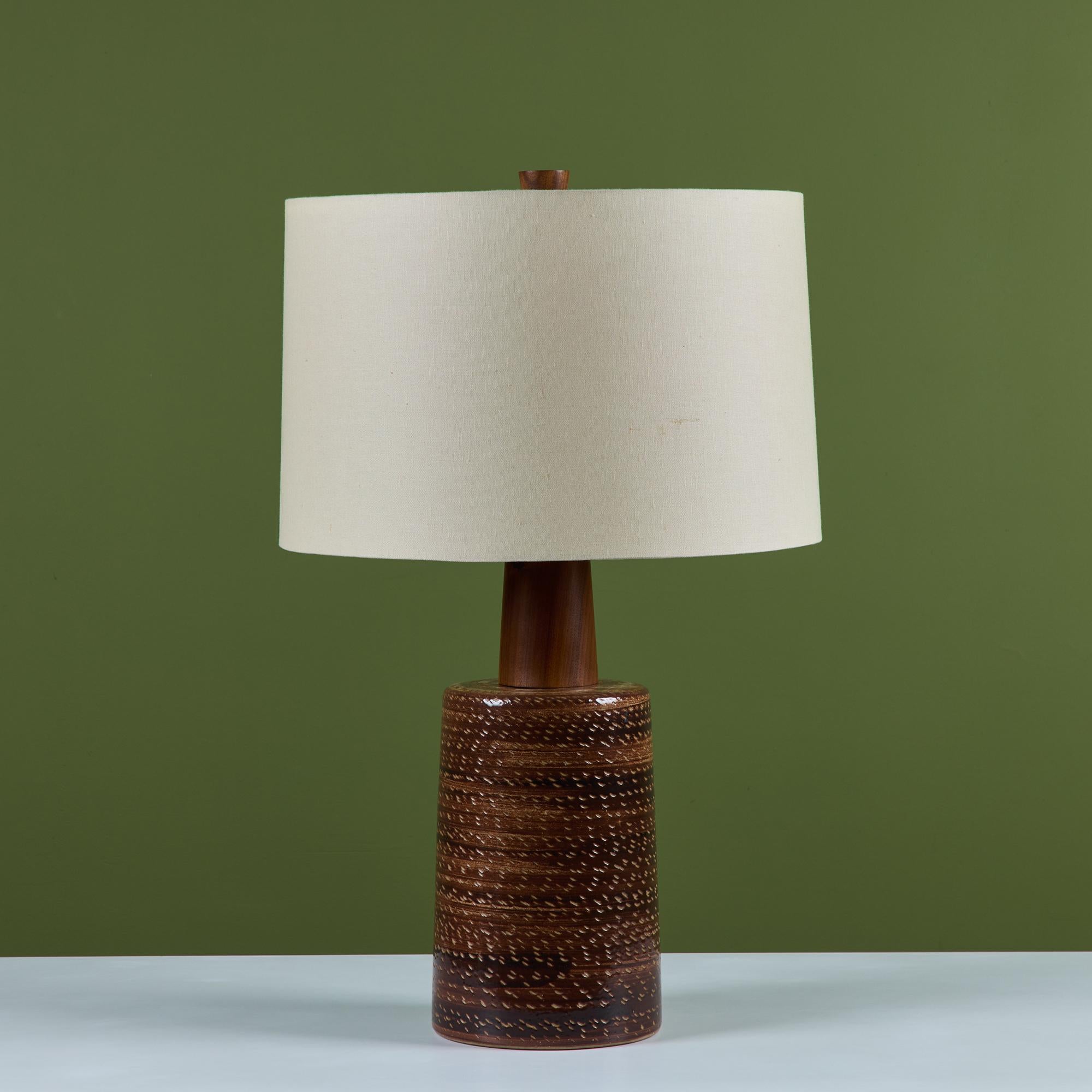 Large scale ceramic lamp by husband-and-wife design team Gordon and Jane Martz. Produced by their family company, Marshall Studios in Indiana beginning in 1957. The lamp features a glossy brown glaze with an all over incised pattern. The lamp has a