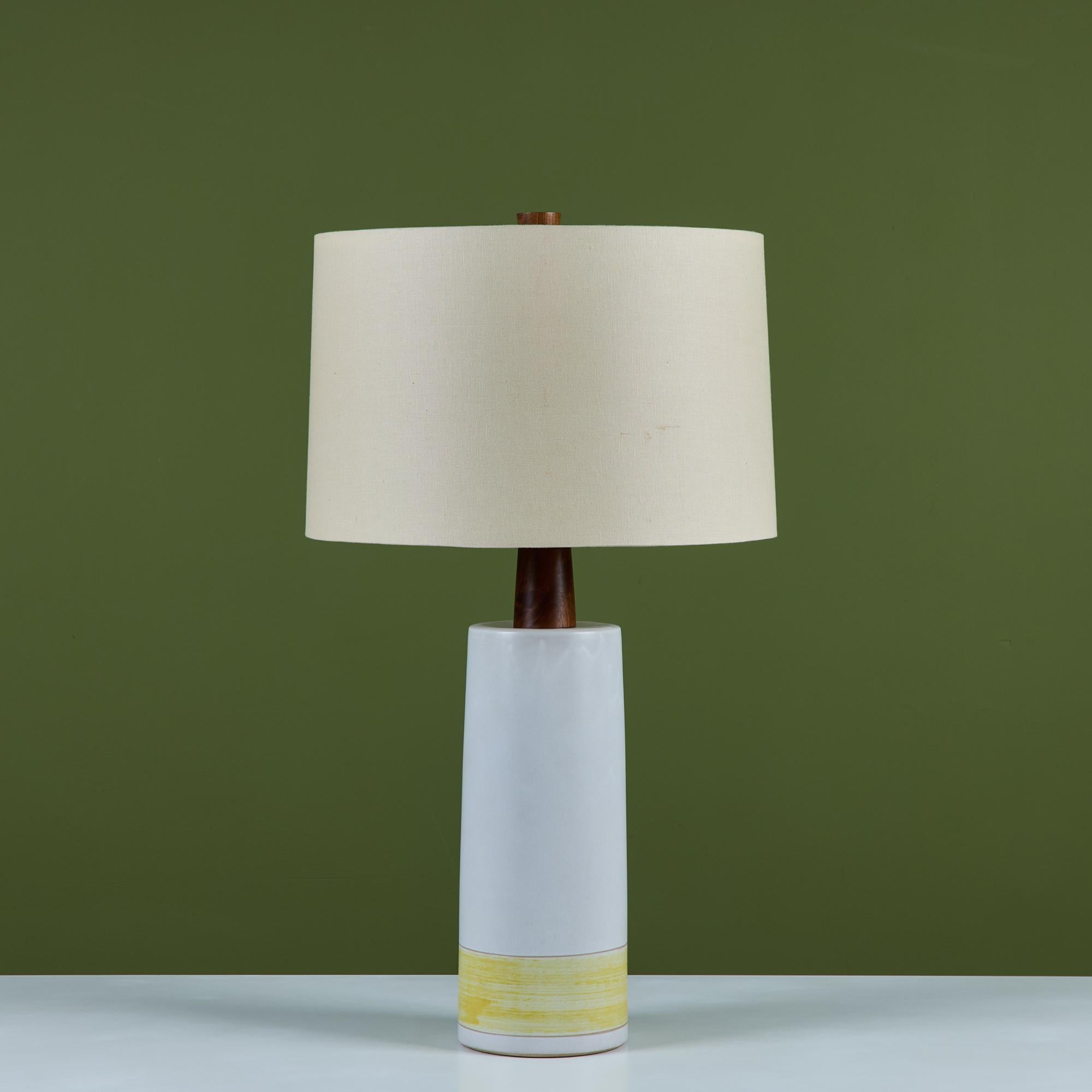 Striking large ceramic table lamp by husband-and-wife design team Gordon and Jane Martz. Produced by their family company, Marshall Studios in Indiana beginning in 1957. The lamp features a matte cream glaze with a soft yellow banding at the base.