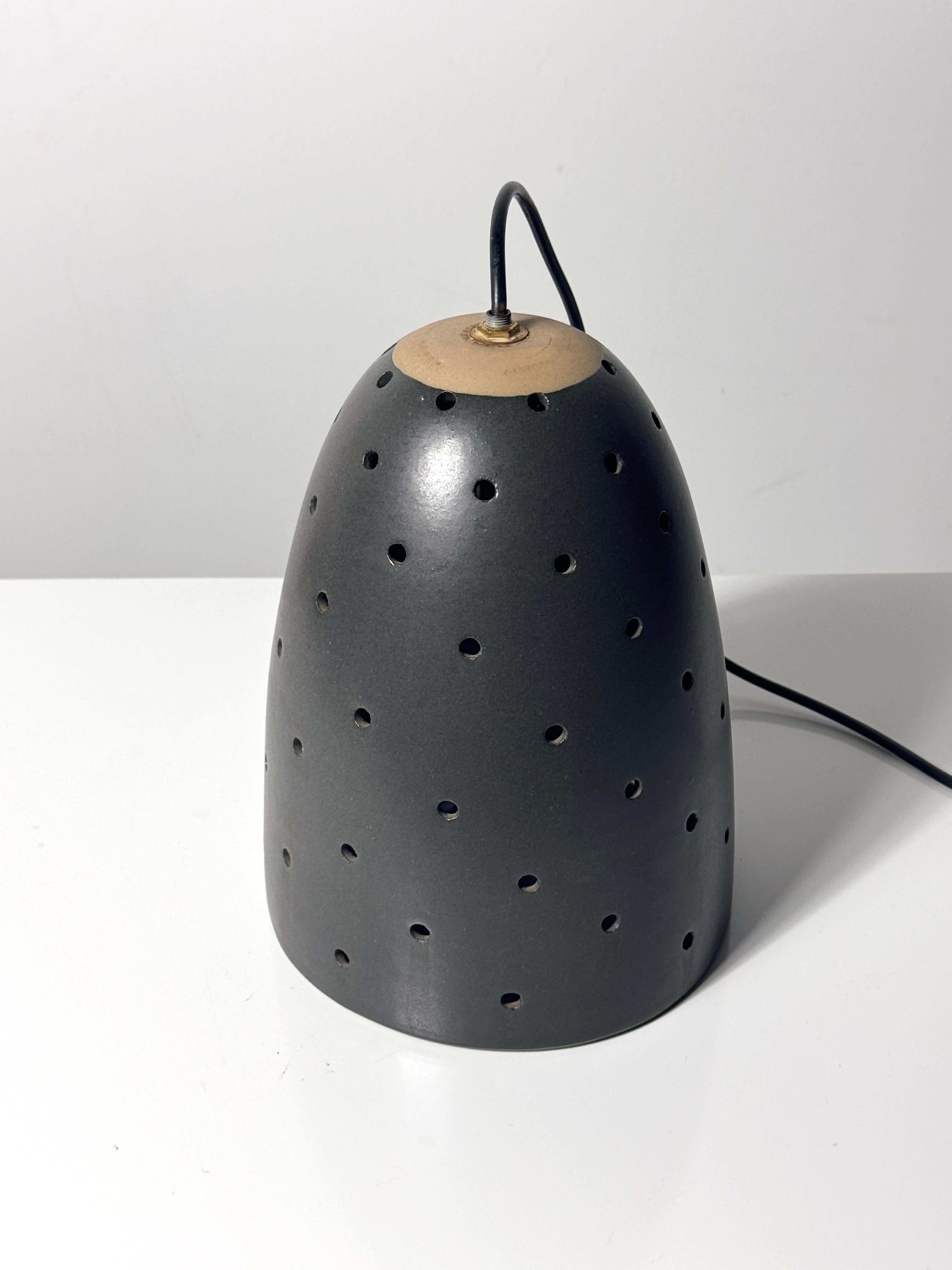 Gordon and Jane Martz Marshall Studios Pierced Black Ceramic Pendant Lamp 1960s 2