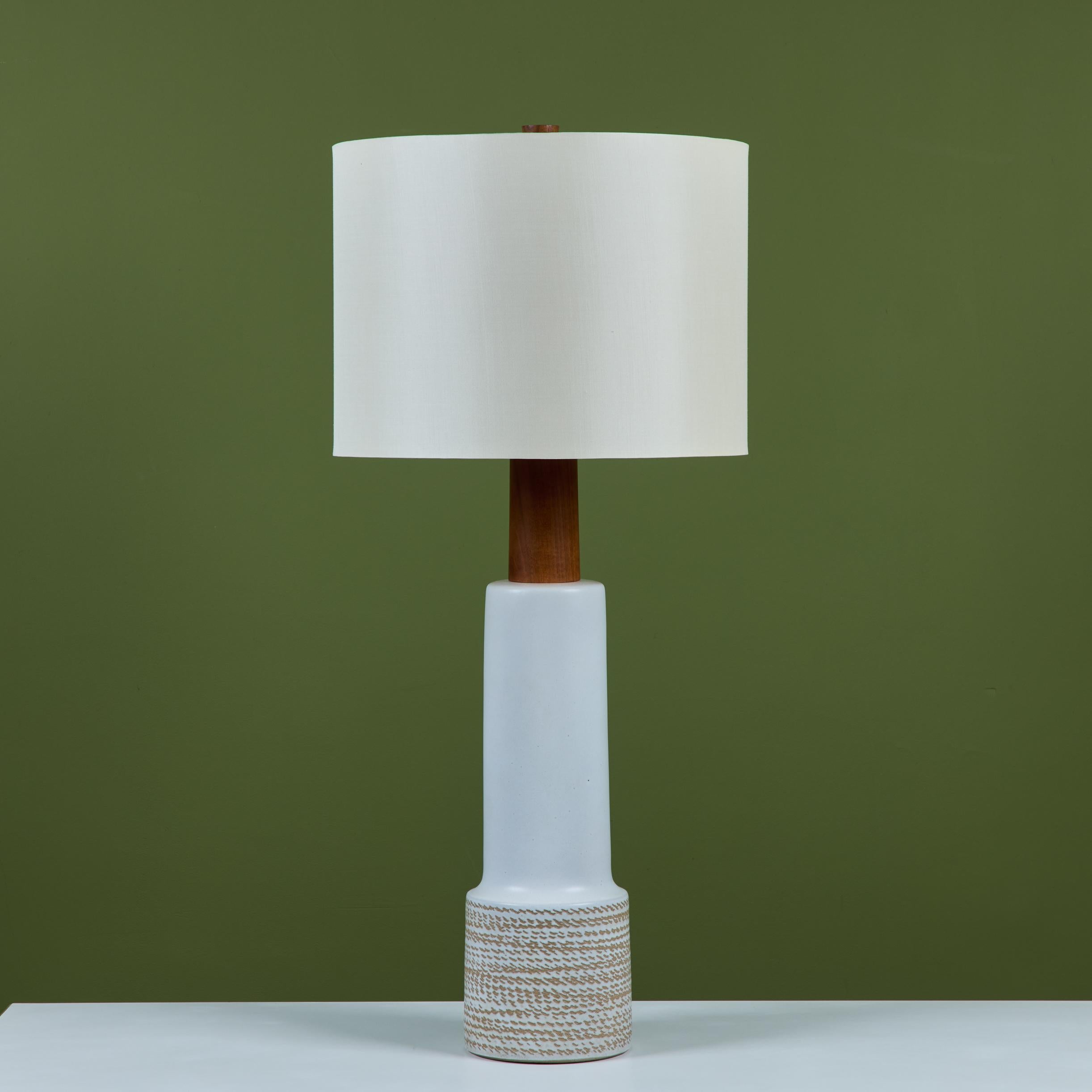 Striking oversized ceramic lamp by husband-and-wife design team Gordon and Jane Martz. Produced by their family company, Marshall Studios in Indiana beginning in 1957. The lamp features a matte cream glaze with an all over incised pattern at the