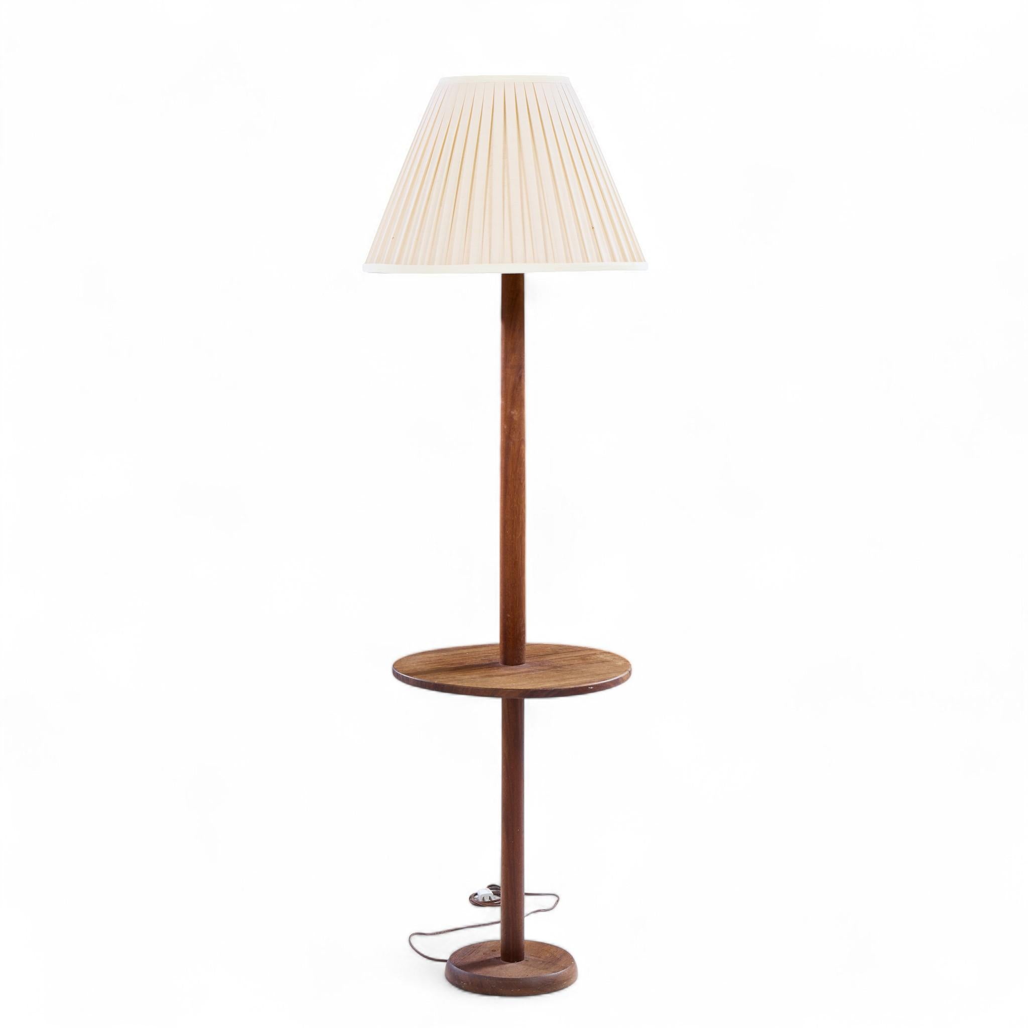 Gordon and Jane Martz Style Mid Century Walnut Floor Lamp Table

This lamp measures: 15.75 wide x 15.75 deep x 57.5 inches high

Great Vintage Condition.

We take our photos in a controlled lighting studio to show as much detail as possible. We do