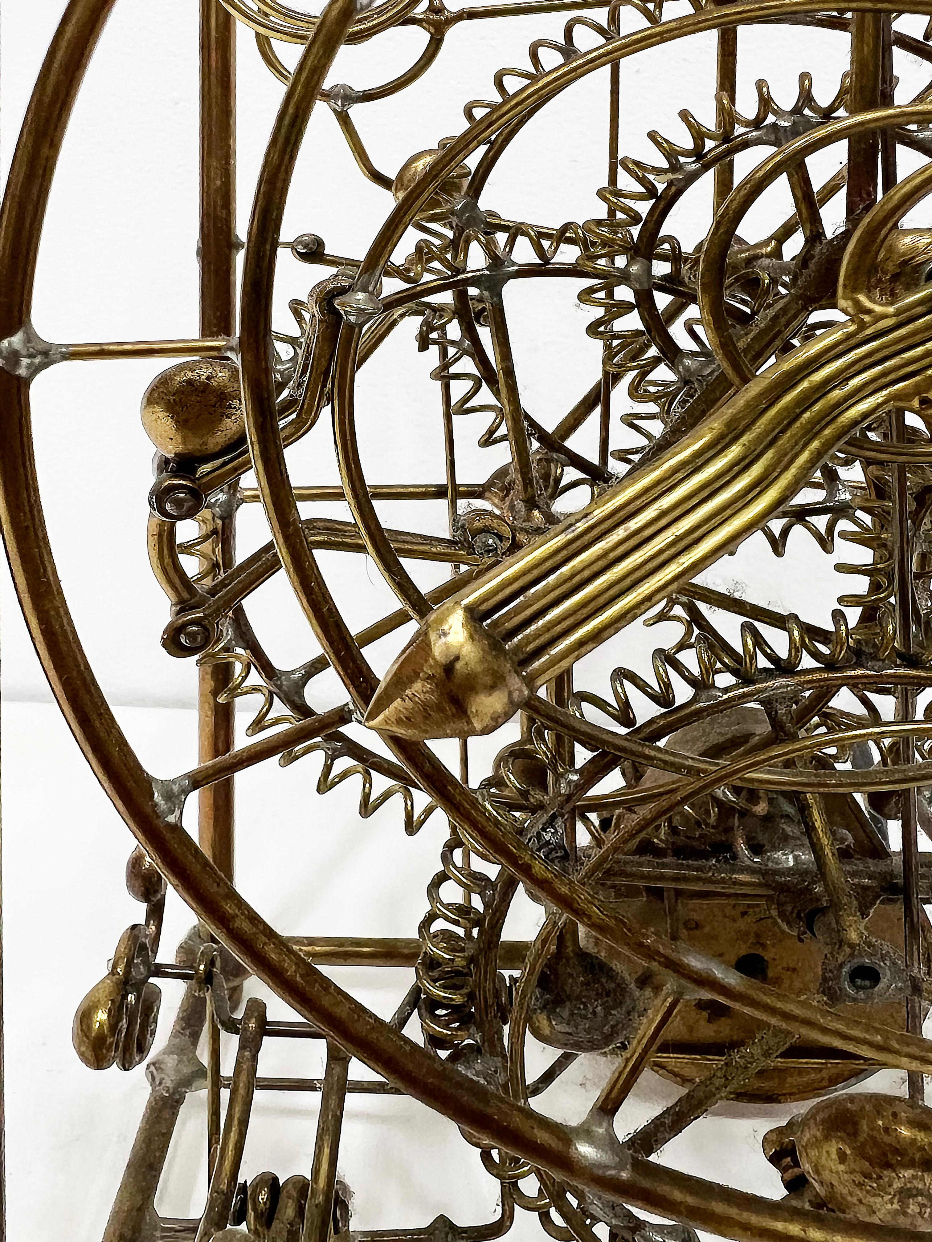 Gordon Bradt 6 Man Kinetic Electric Skeleton Table Clock, 1993

Offered for sale is a Gordon Bradt Six Man Kinetic eclectic table clock manufactured be Kinetic Industries circa 1993. The piece is an open brass skeleton clock that incorporates the