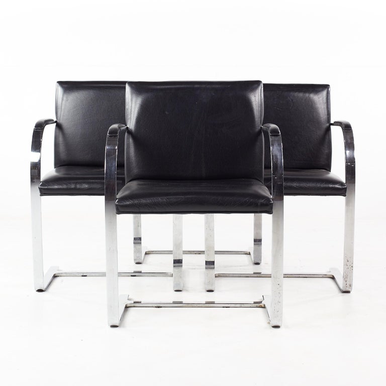 Gordon BRNO mid-century flat bar black leather chairs - set of 4.

Each chair measures: 22.5 wide x 22 deep x 32.5 high, with a seat height of 18 and arm height/chair clearance 26 inches.

All pieces of furniture can be had in what we call