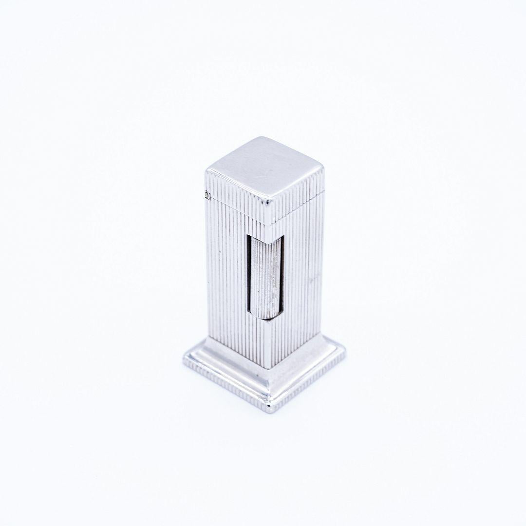 Metal Gordon Bunshaft's Collection: Lighter, Paperweight, Shovel Pin and Glass Piece For Sale