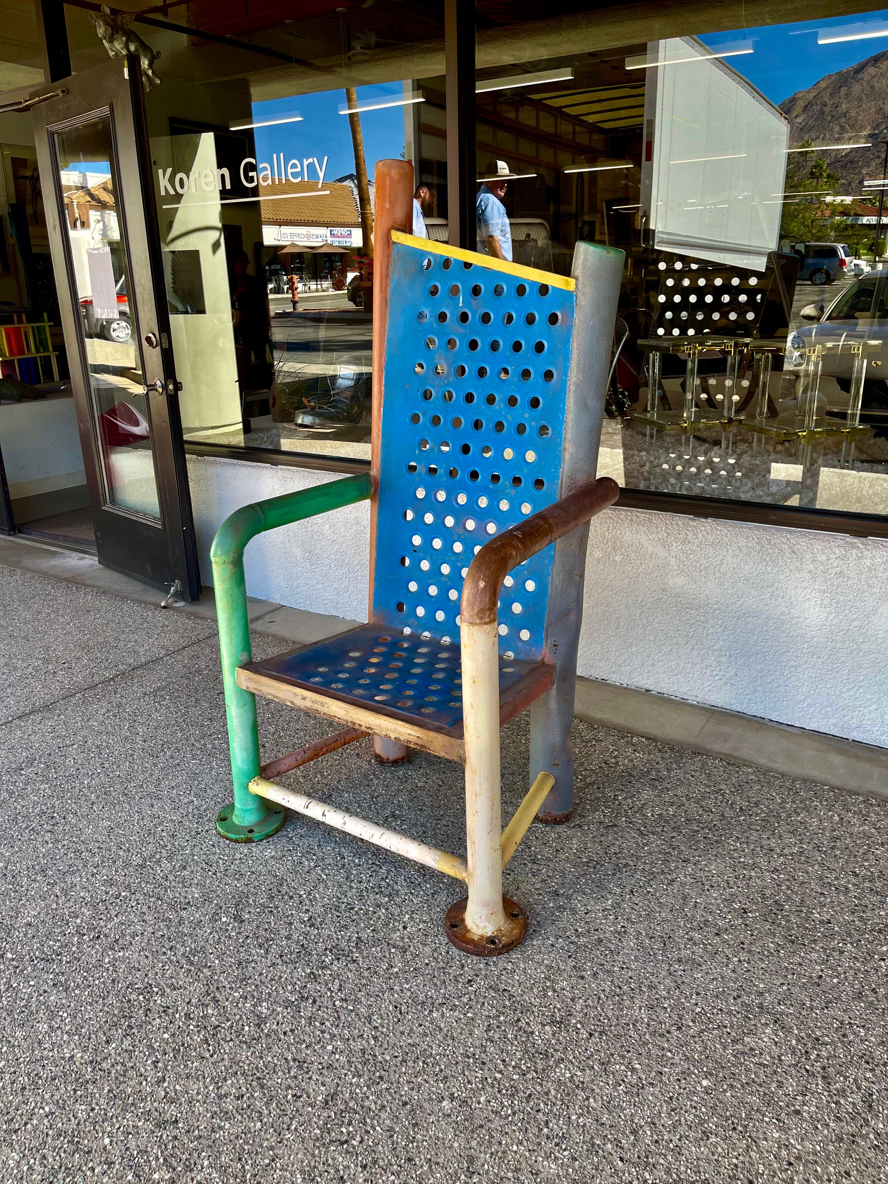 A fabulous massive chair sculpture by the noted artist Gordon Chandler. It is signed and dated with a plate on the leg 2001. Numbered 1509. The artist uses found objects to create beautiful functional sculpture. The chair was used in a garden. Great