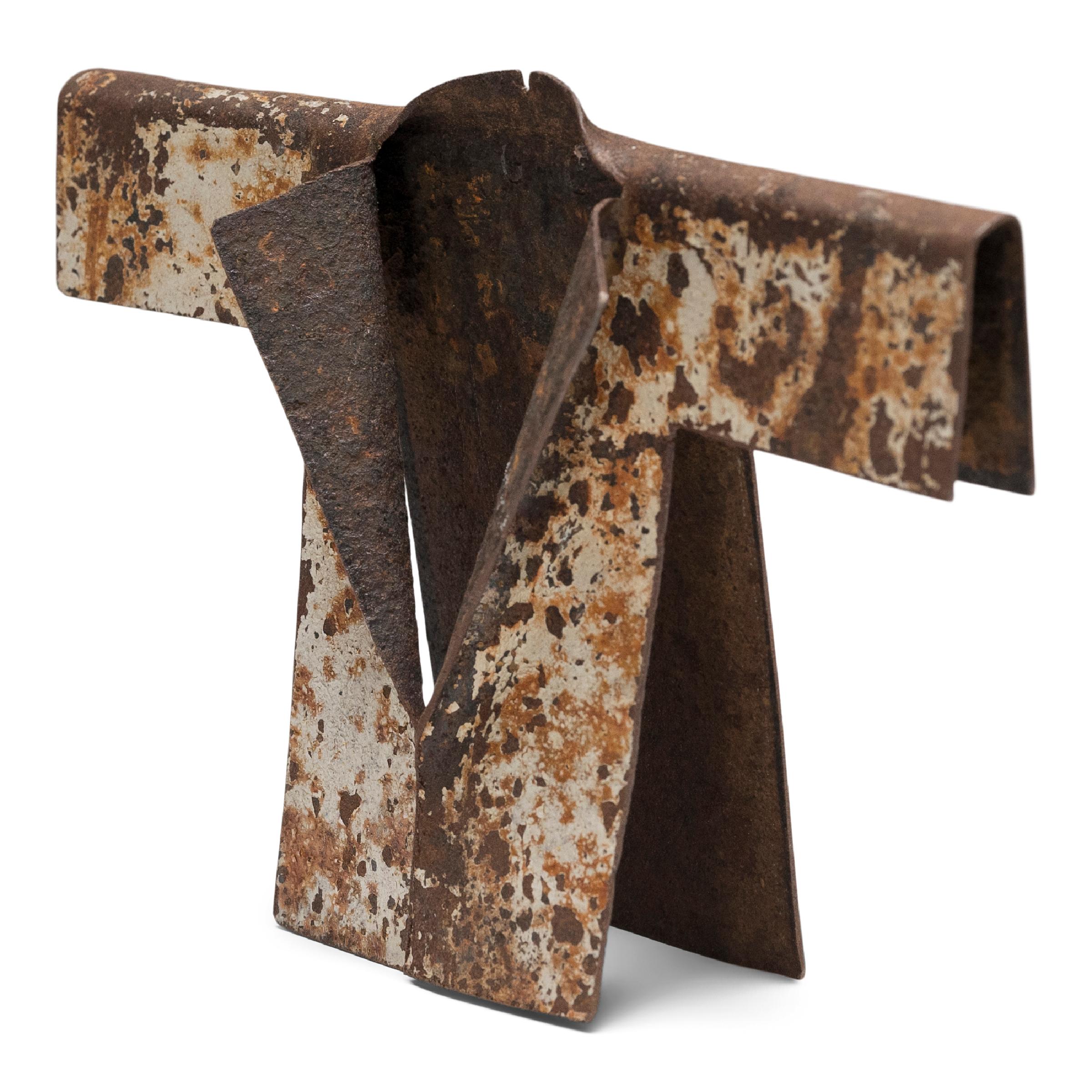 Upon discovering a weathered steel drum that had been warped to resemble the sleeve of a garment, artist Gordon Chandler was inspired to embark on a series of kimono sculptures formed from found metal scraps. With an eye to the aesthetic