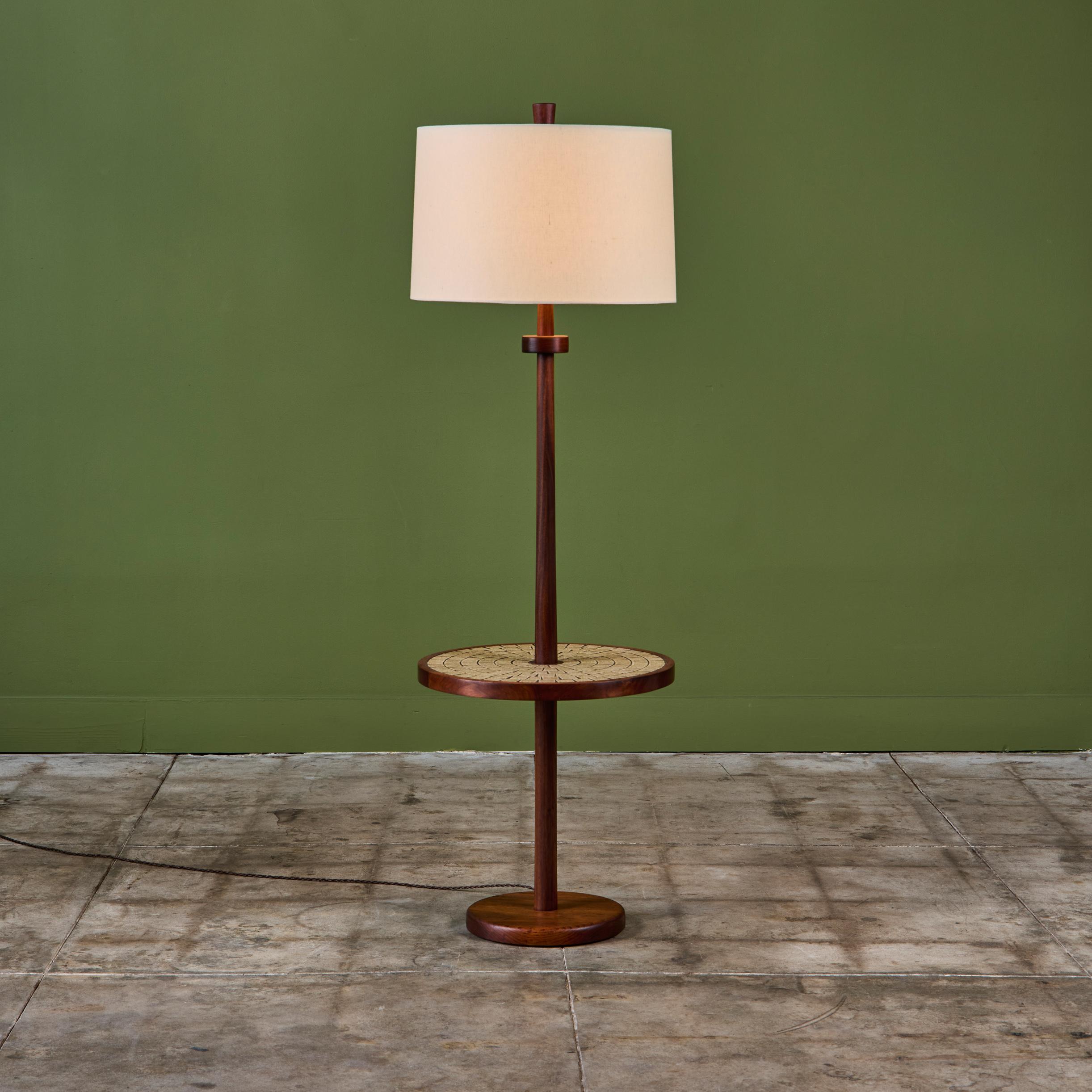 Gordon & Jane Martz floor lamp with mosaic tile round side table. This piece features a walnut base with inlaid tan and cream speckle glazed square ceramic tiles on the table top. The lamp has a newly made linen shade and new