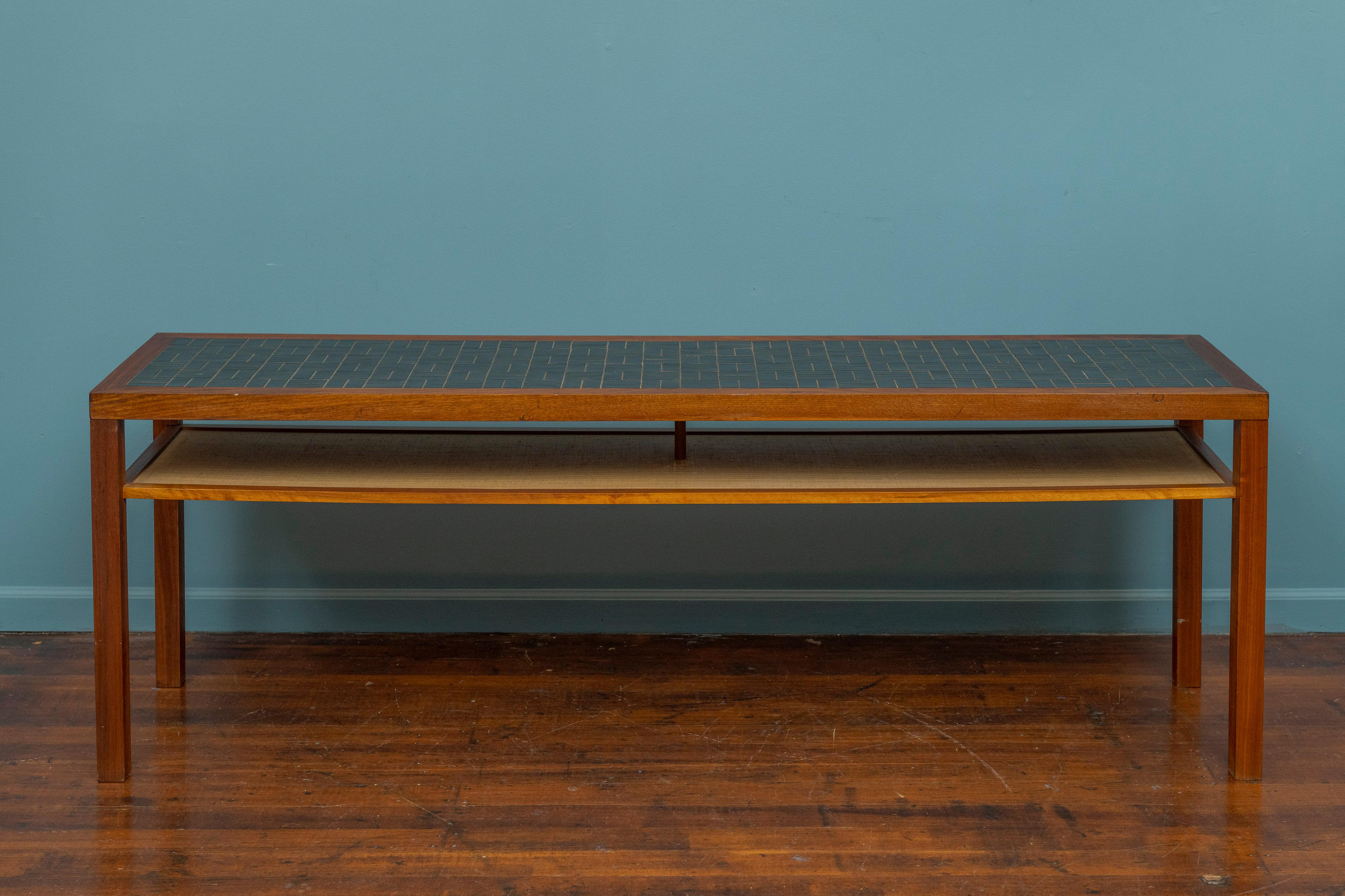 Gordon & Jane Martz design walnut console table. Sophisticated design by Gordon & Jane Martz with their signature walnut and ceramic tile combination. High quality construction and materials with a grass cloth lined under shelf. Ready to be