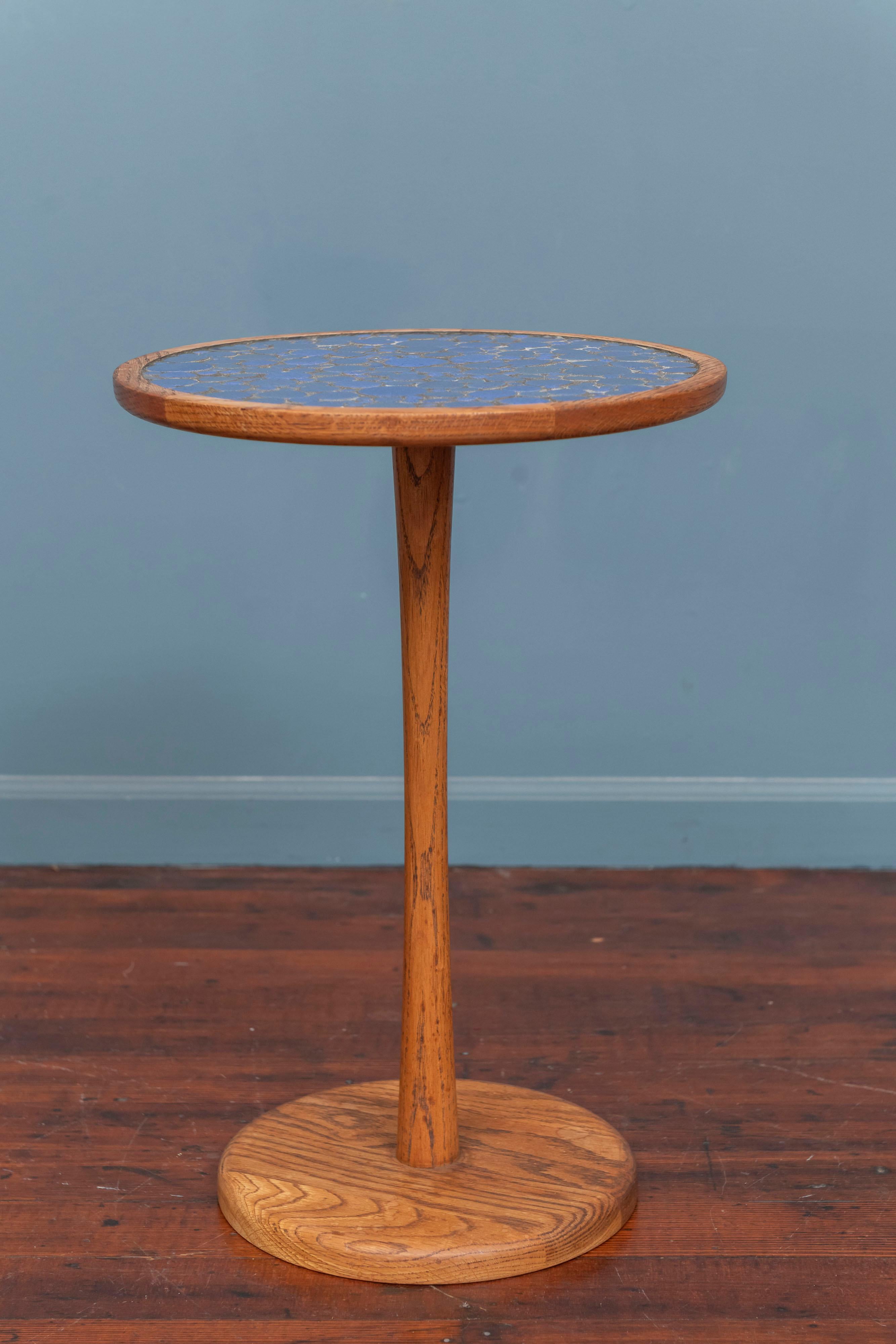 Gordon & Jane Martz tile top side table. Made with an oak weighted base frame and a inset blue tile top. Collectible design by a husband and wife team that produced high quality tables and lighting.