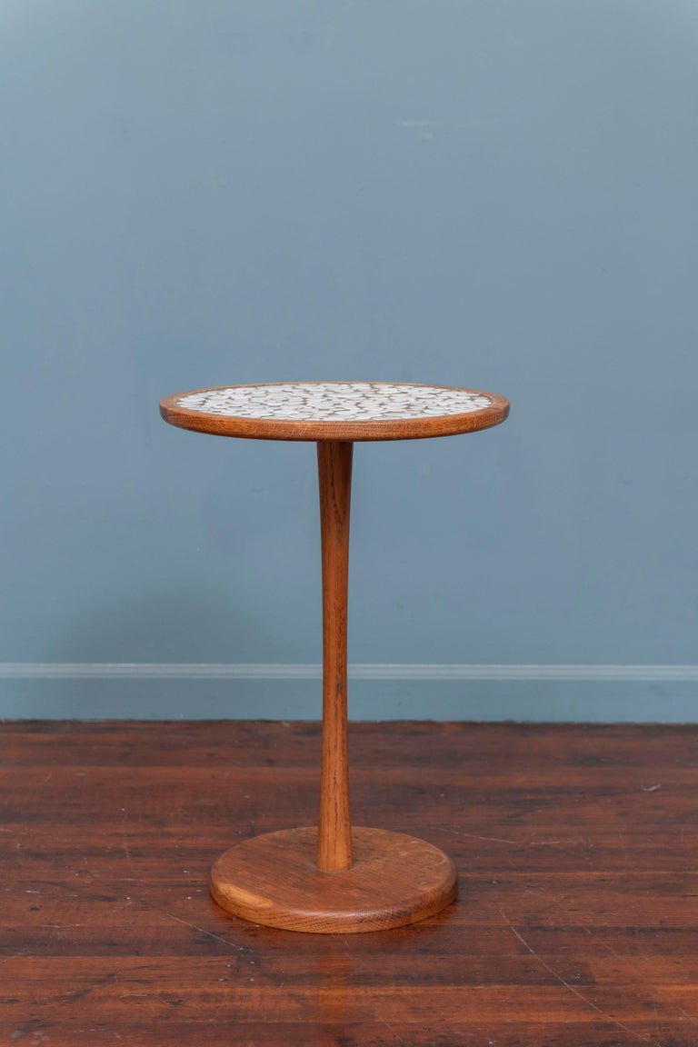 Gordon & Jane Martz tile top side table. Made with a white ceramic tile top on a weighted solid oak base in good original condition. Made from high quality materials and skilled craftsmanship Gordon & Jane Martz tables and lighting are highly sought