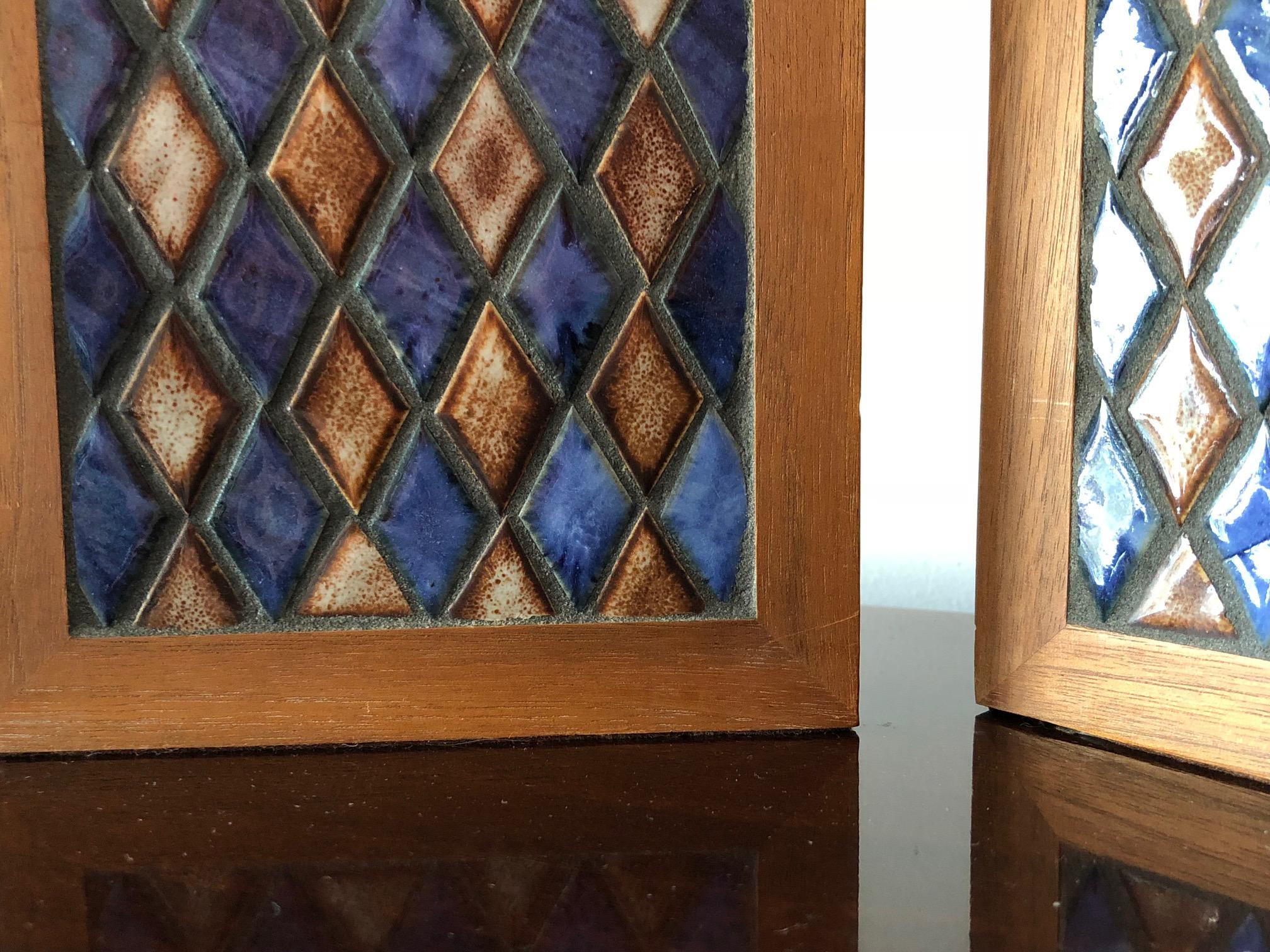 A pair of stylish, 1950s bookends by Gordon Martz. Diamond pattern ceramic tiles, inset into walnut frames, with brass extensions.
