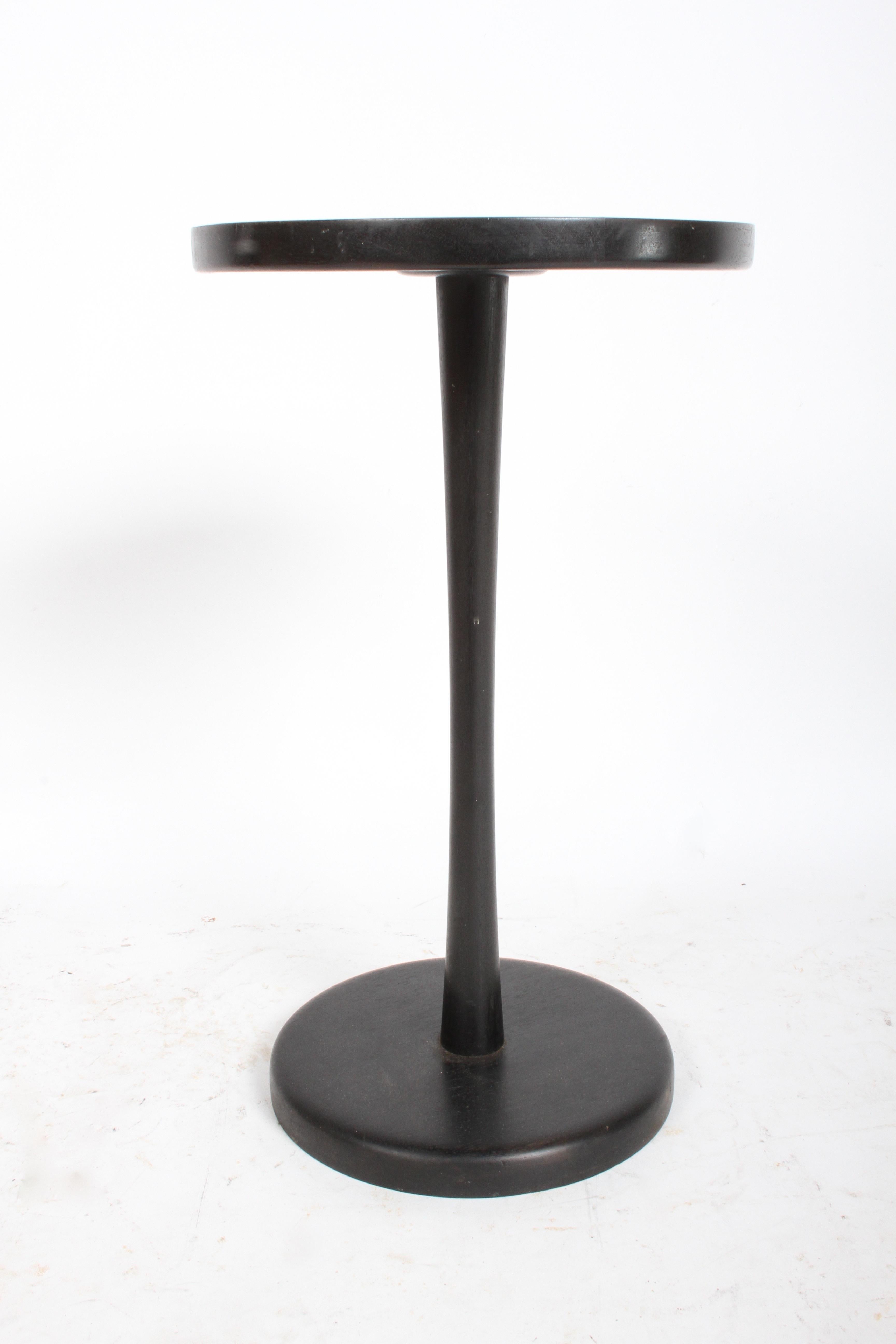 Gordon Martz for Marshall Studios round tile top pedestal or side table with original dark stain. Nice all original condition, some minor scuffs and wear to wood, no damage to round golden colored ceramic tiles. Has weighted cast metal base