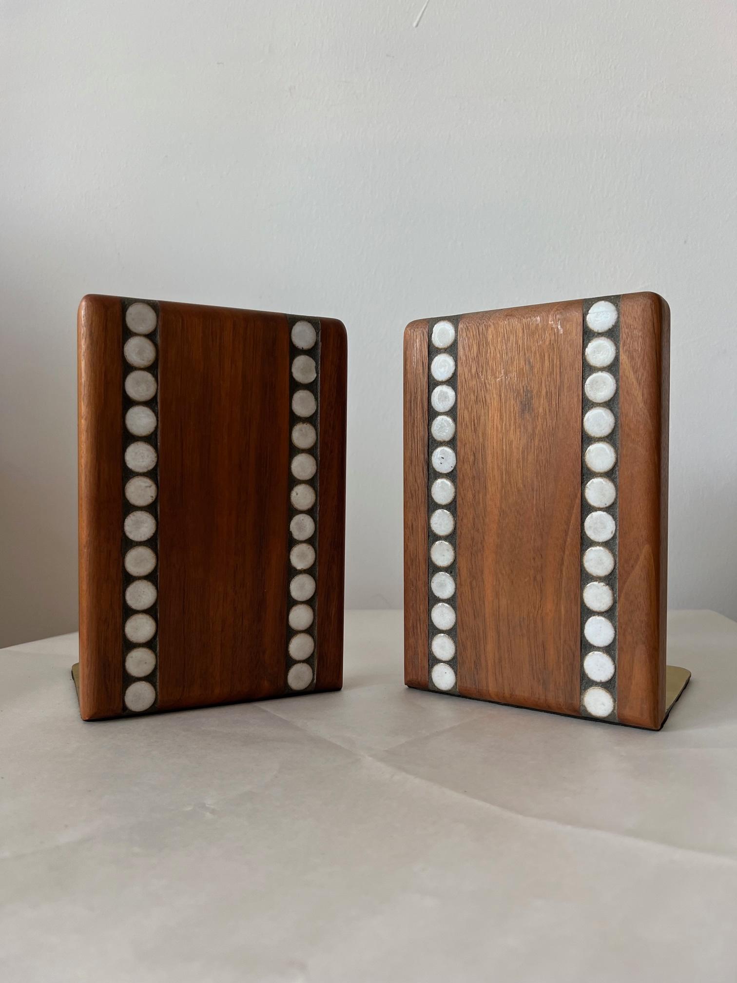 A pair of stylish, 1950s bookends by Gordon Martz. Circular pattern, white ceramic tiles, inset into walnut frames, with brass extensions. Heavy and well made.
