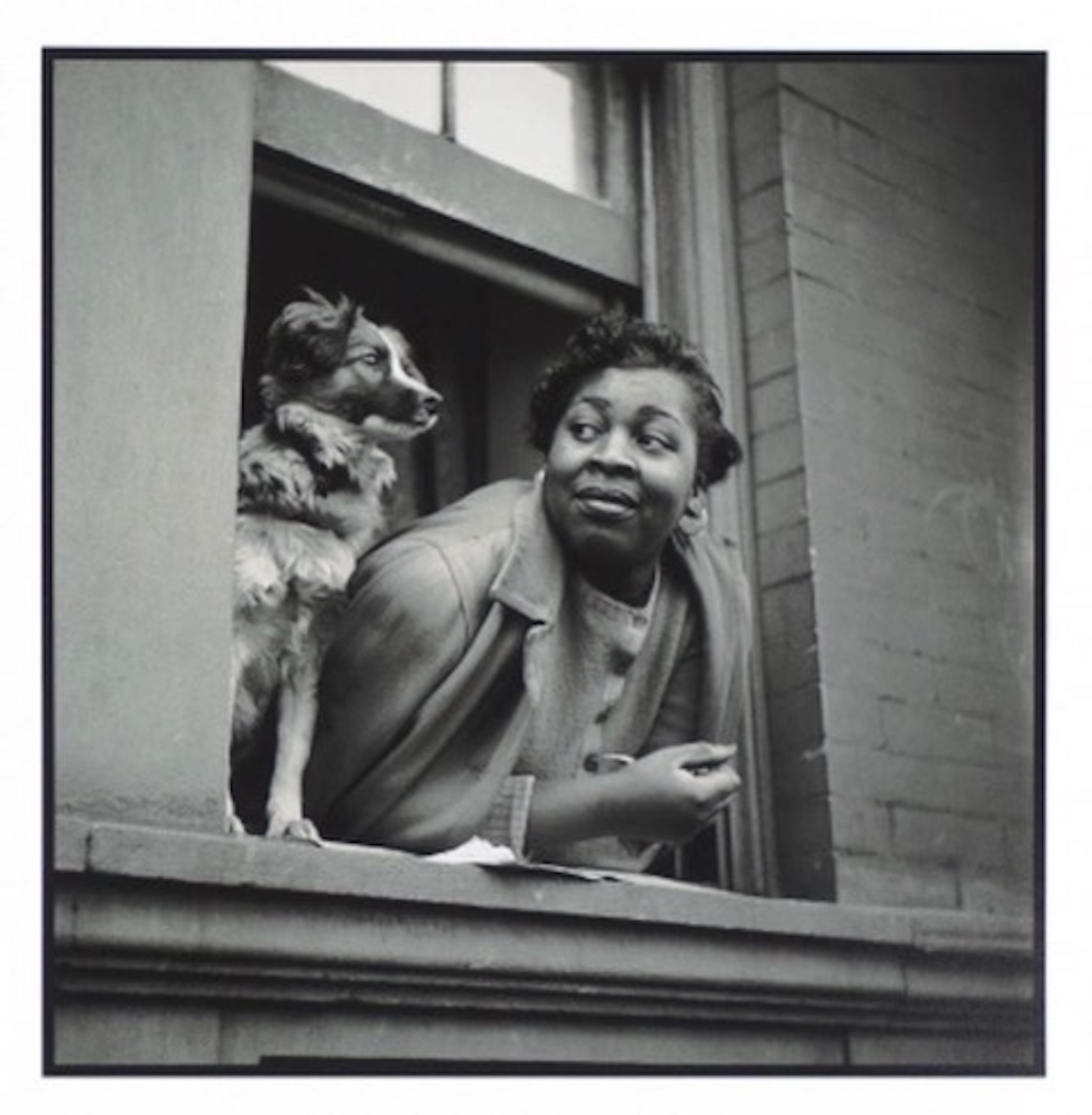 Gordon Parks Black and White Photograph - Woman and Dog in Window, Harlem from the Rede Leonardo Portfolio