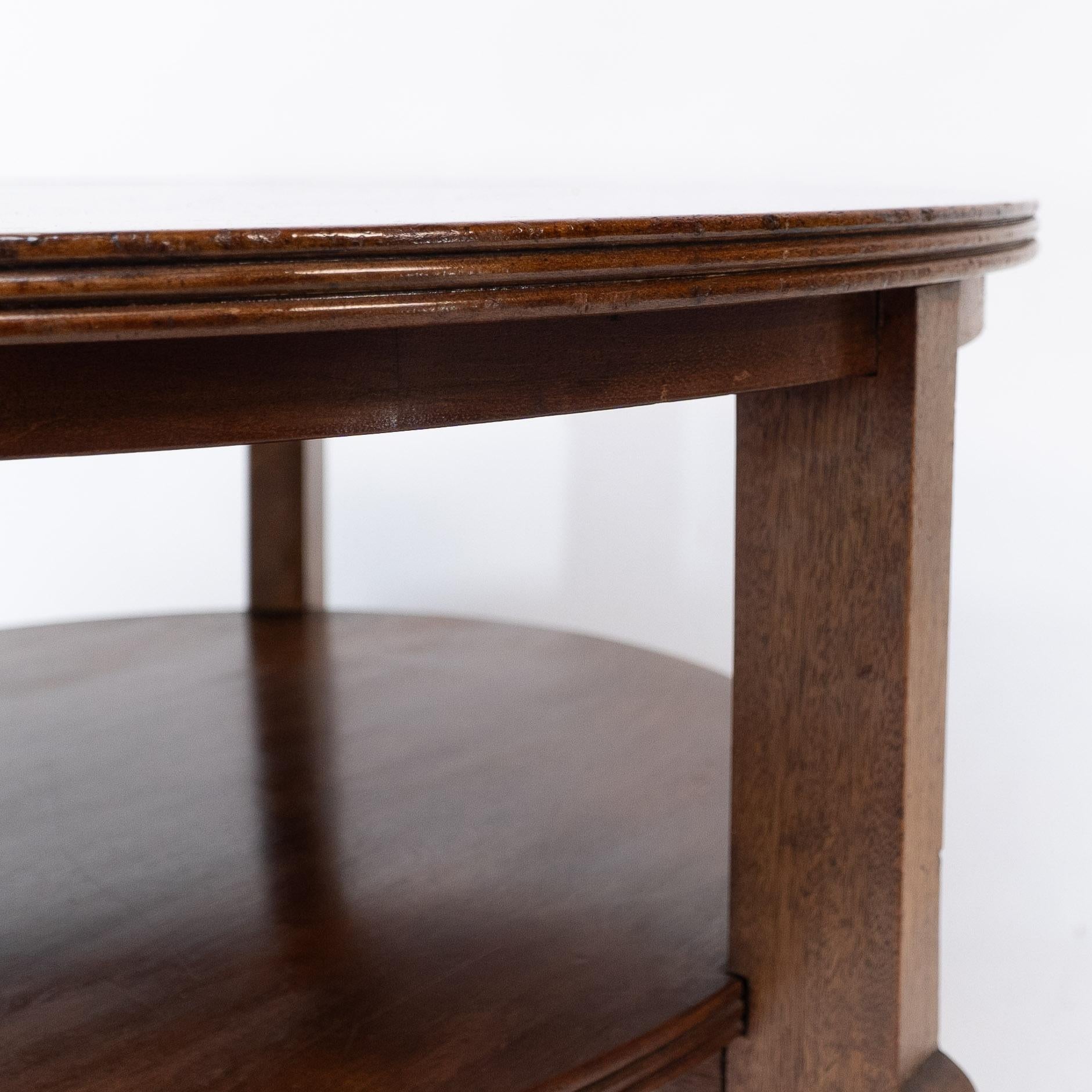 Gordon Russell. A gunstock figured walnut coffee table on gunstock shaped legs 3