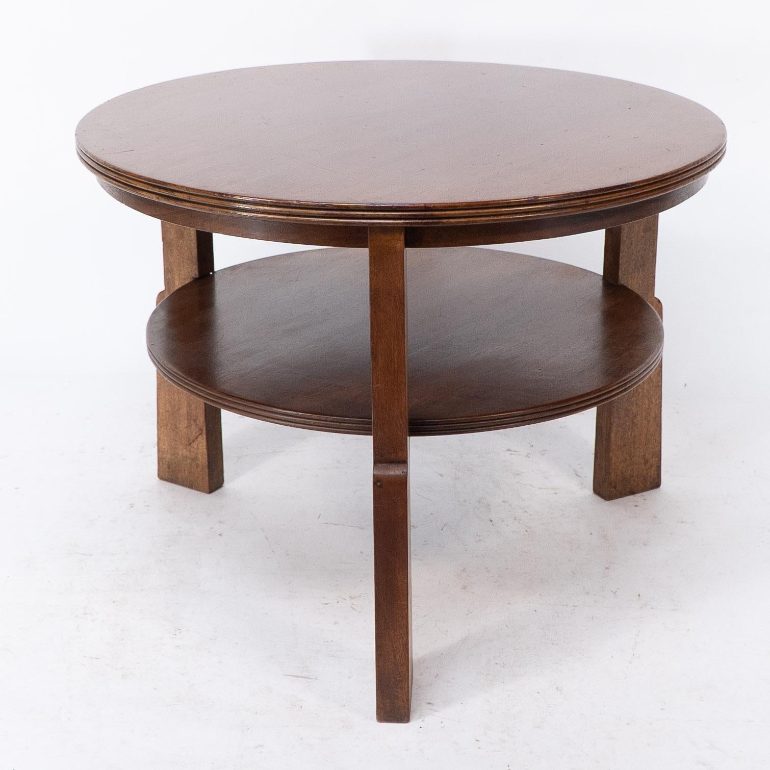 Arts and Crafts Gordon Russell. A gunstock figured walnut coffee table on gunstock shaped legs For Sale