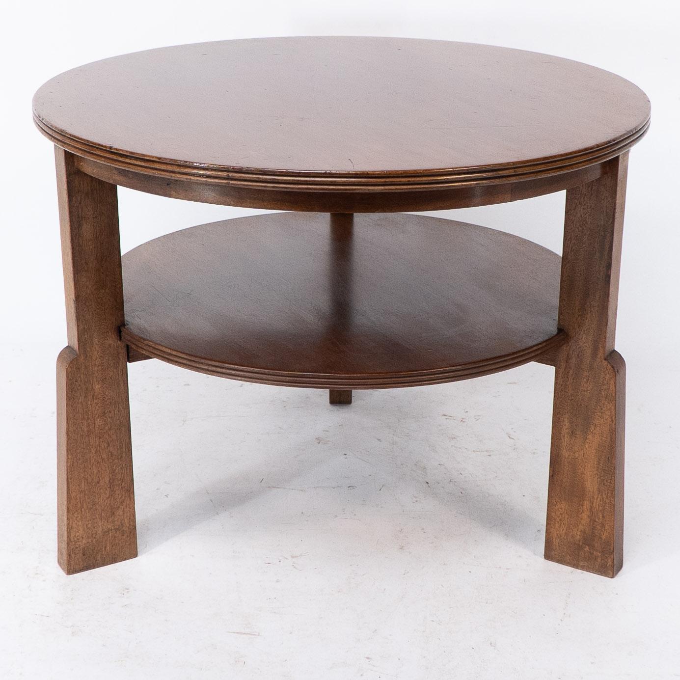 English Gordon Russell. A gunstock figured walnut coffee table on gunstock shaped legs