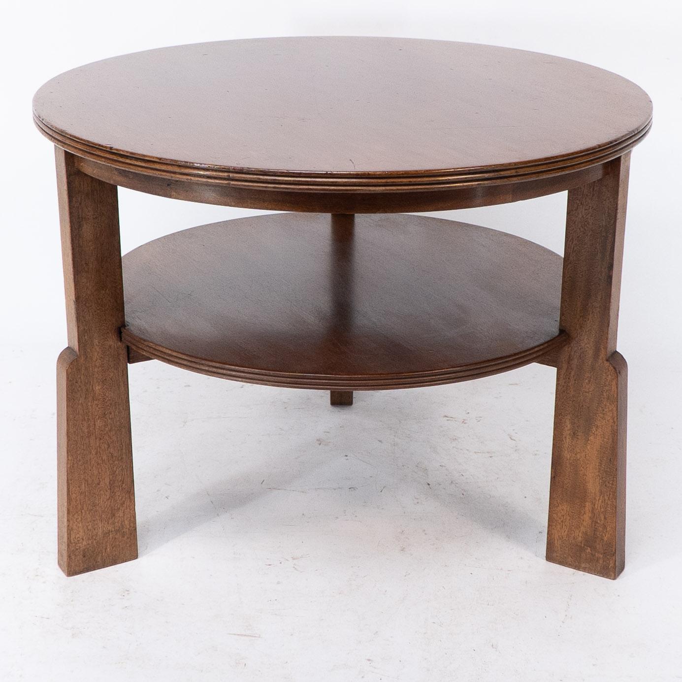 Arts and Crafts Gordon Russell. A gunstock figured walnut coffee table on gunstock shaped legs