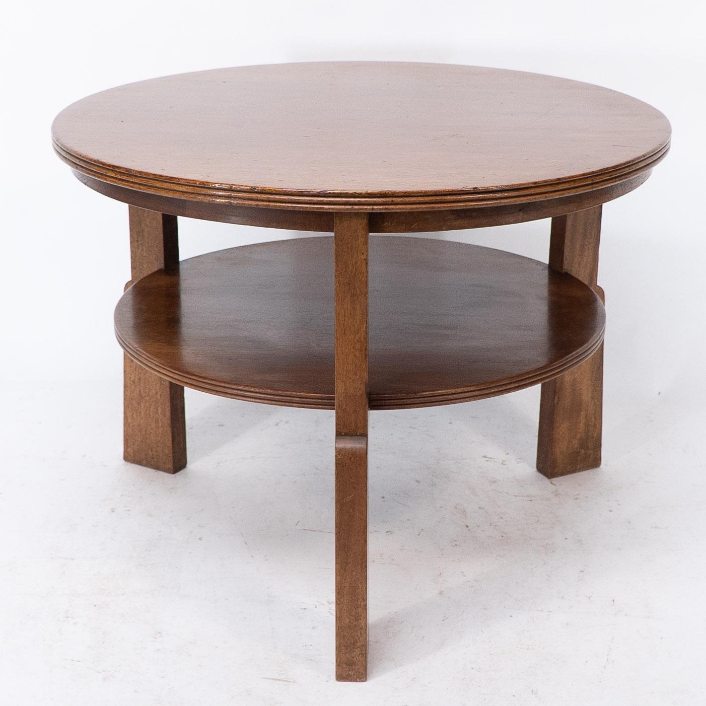 Hand-Crafted Gordon Russell. A gunstock figured walnut coffee table on gunstock shaped legs