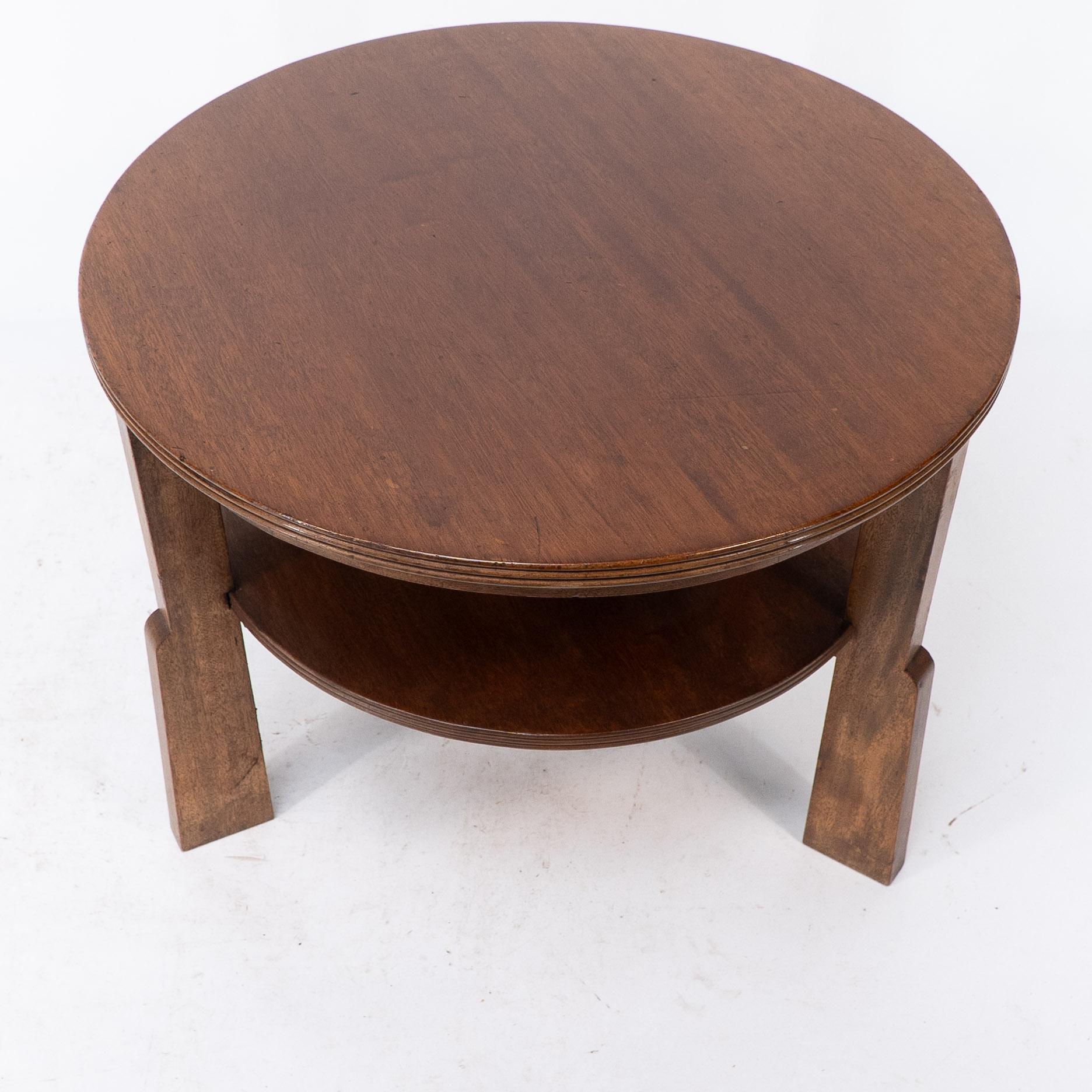 Early 20th Century Gordon Russell. A gunstock figured walnut coffee table on gunstock shaped legs