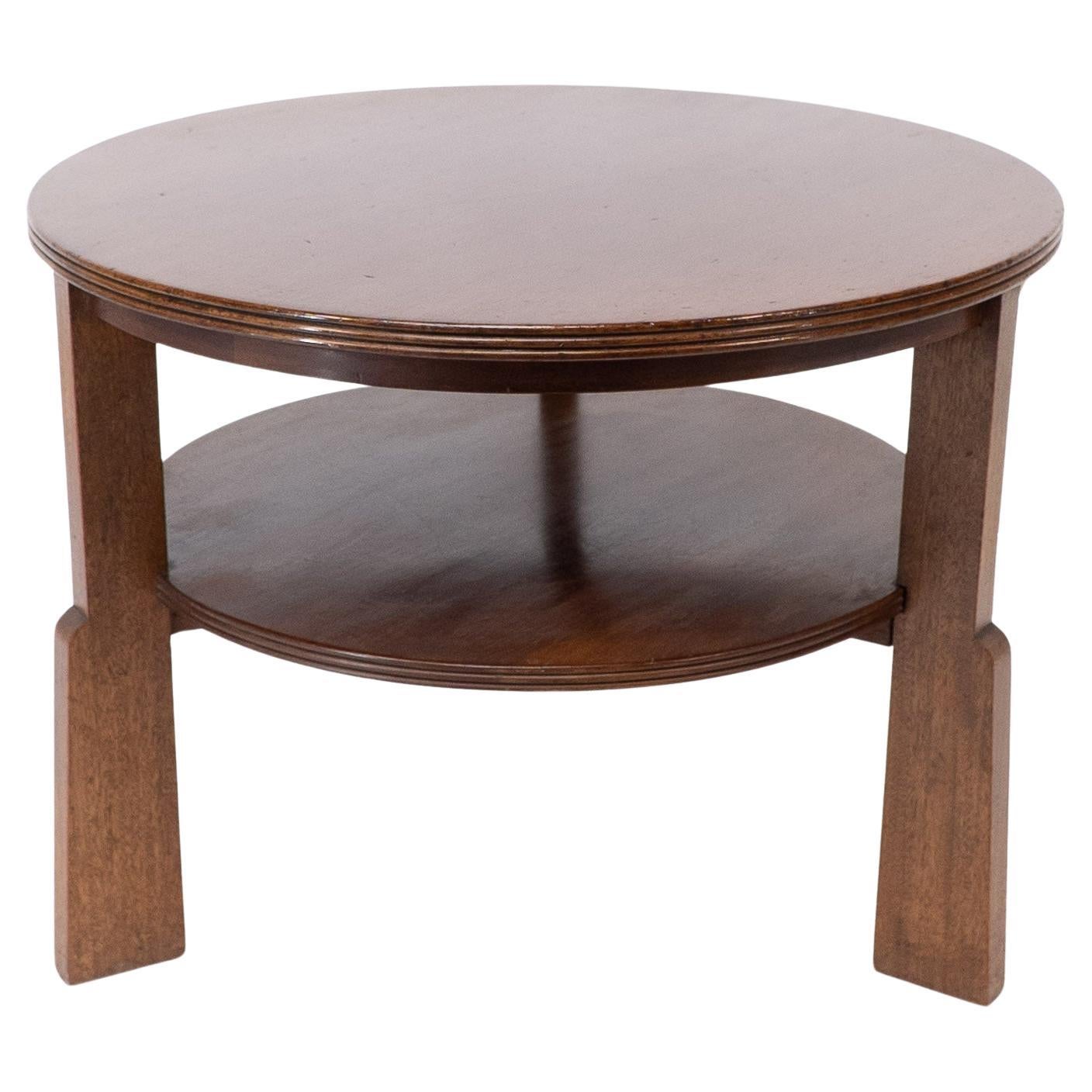 Gordon Russell. A gunstock figured walnut coffee table on gunstock shaped legs For Sale