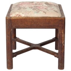 Gordon Russell, an Arts & Crafts Cotswold Oak Stool with Carved Cross Stretcher