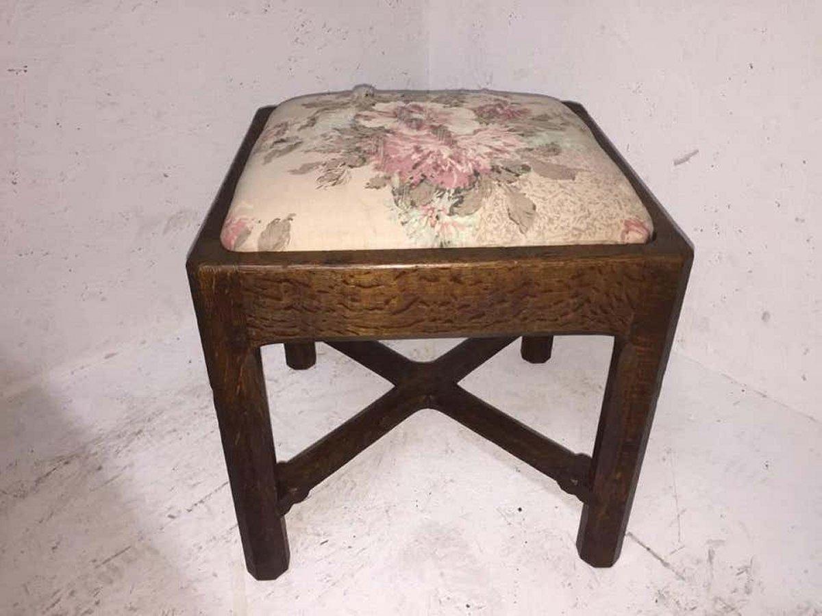 English Gordon Russell, an Arts & Crafts Cotswold Oak Stool with Carved Cross Stretcher