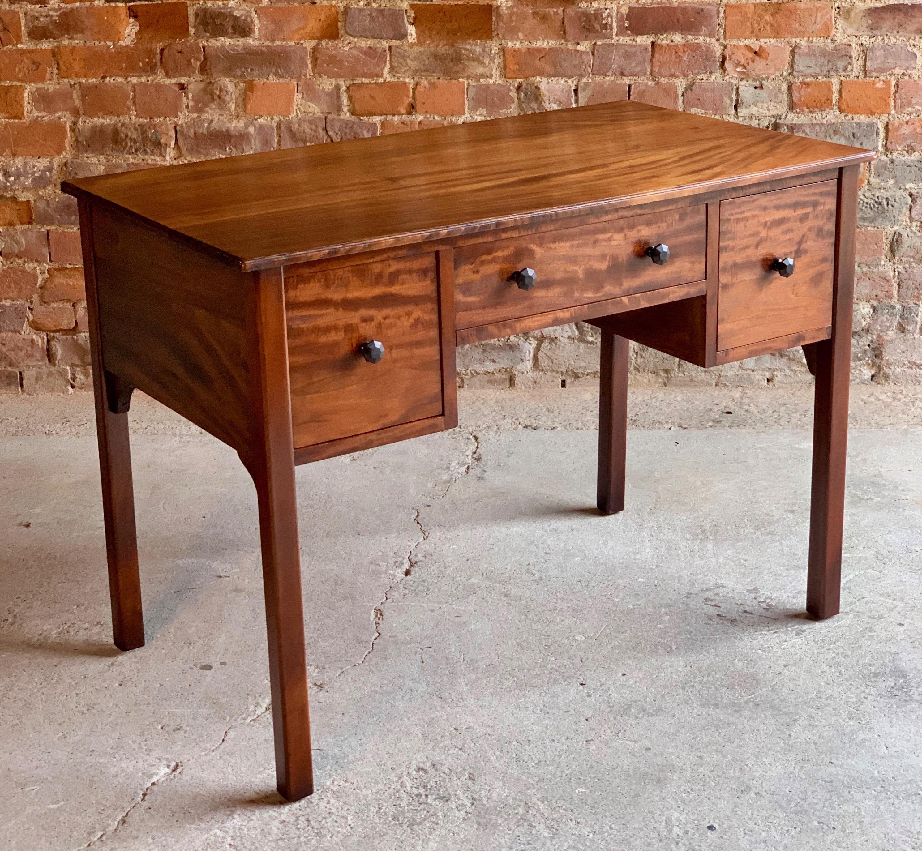 Gordon Russell cuban mahogany writing desk 1929

Extremely rare Gordon Russell Cuban mahogany, Cedar lined writing desk, designed by Gordon Russell, dated September 14th 1929, the moulded rectangular top fitted over three drawers with turned and
