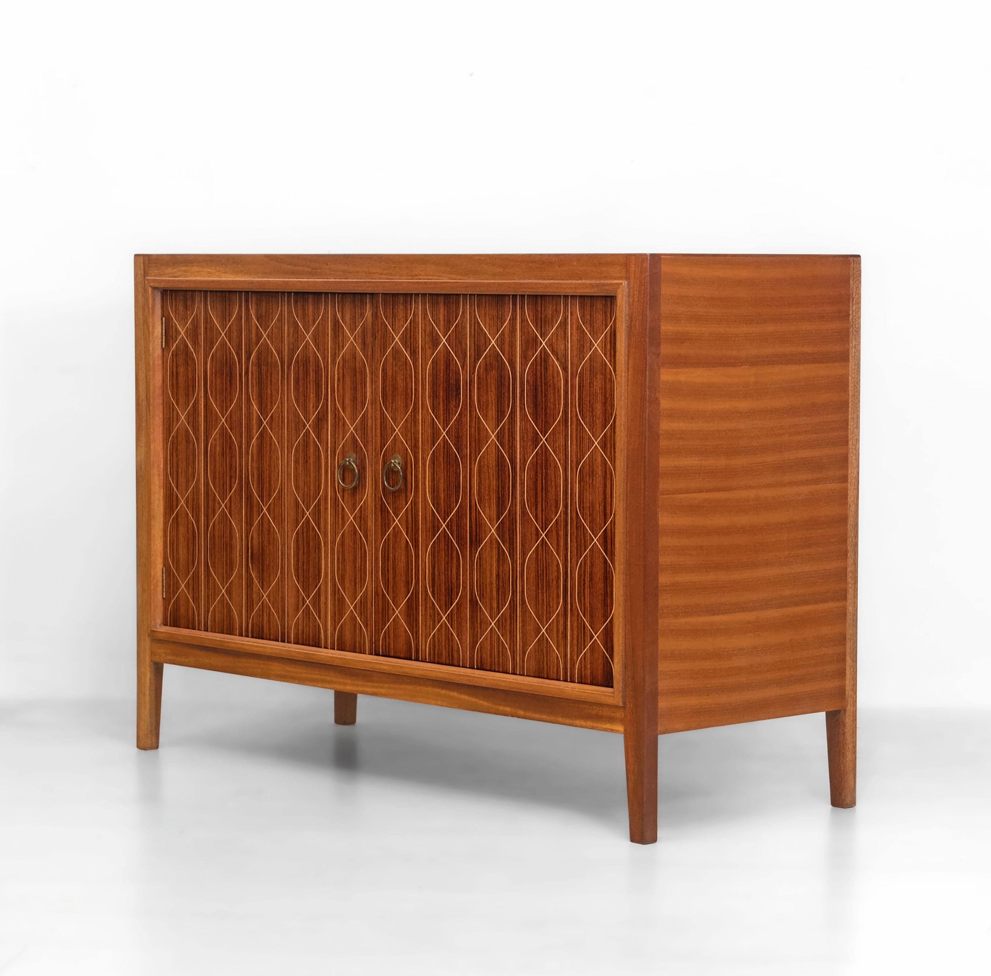 Gordon Russell Helix sideboard, model no. R407. Designed in 1950 by David Booth and Judith Ledeboer. Circa 1950s.

Architectural firm Booth & Ledeboer was founded by David Booth (1908-1962) and Judith Ledeboer (1901-1990) in Britain in the late