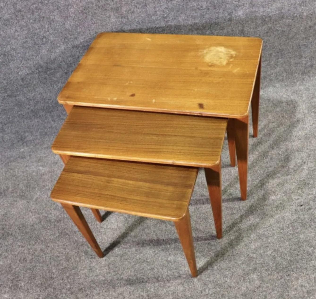 Set of teak nesting tables made by Gordon Russell Ltd (UK). Perfect side table use for company.
Please confirm location NY or NJ