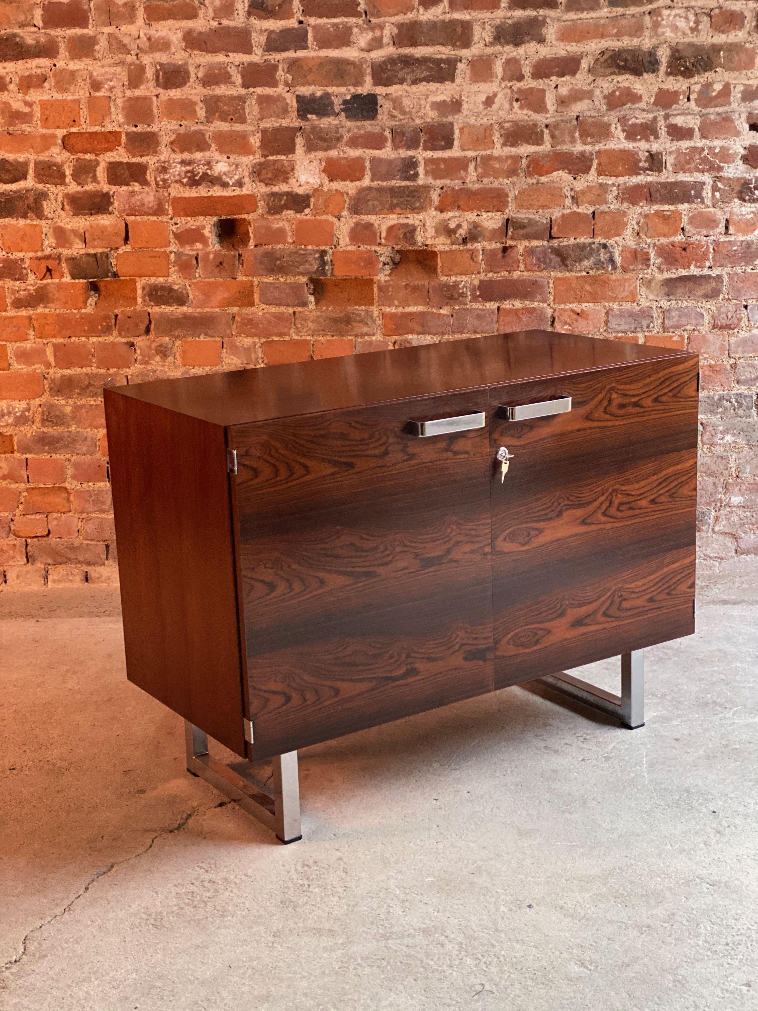 Gordon Russell rosewood credenza prestige range by Trevor Chinn, circa 1975

Gordon Russell rosewood credenza from the Prestige range designed by Ray Leigh and Trevor Chinn circa 1975, Palisander rosewood and chrome, the rectangular top over two